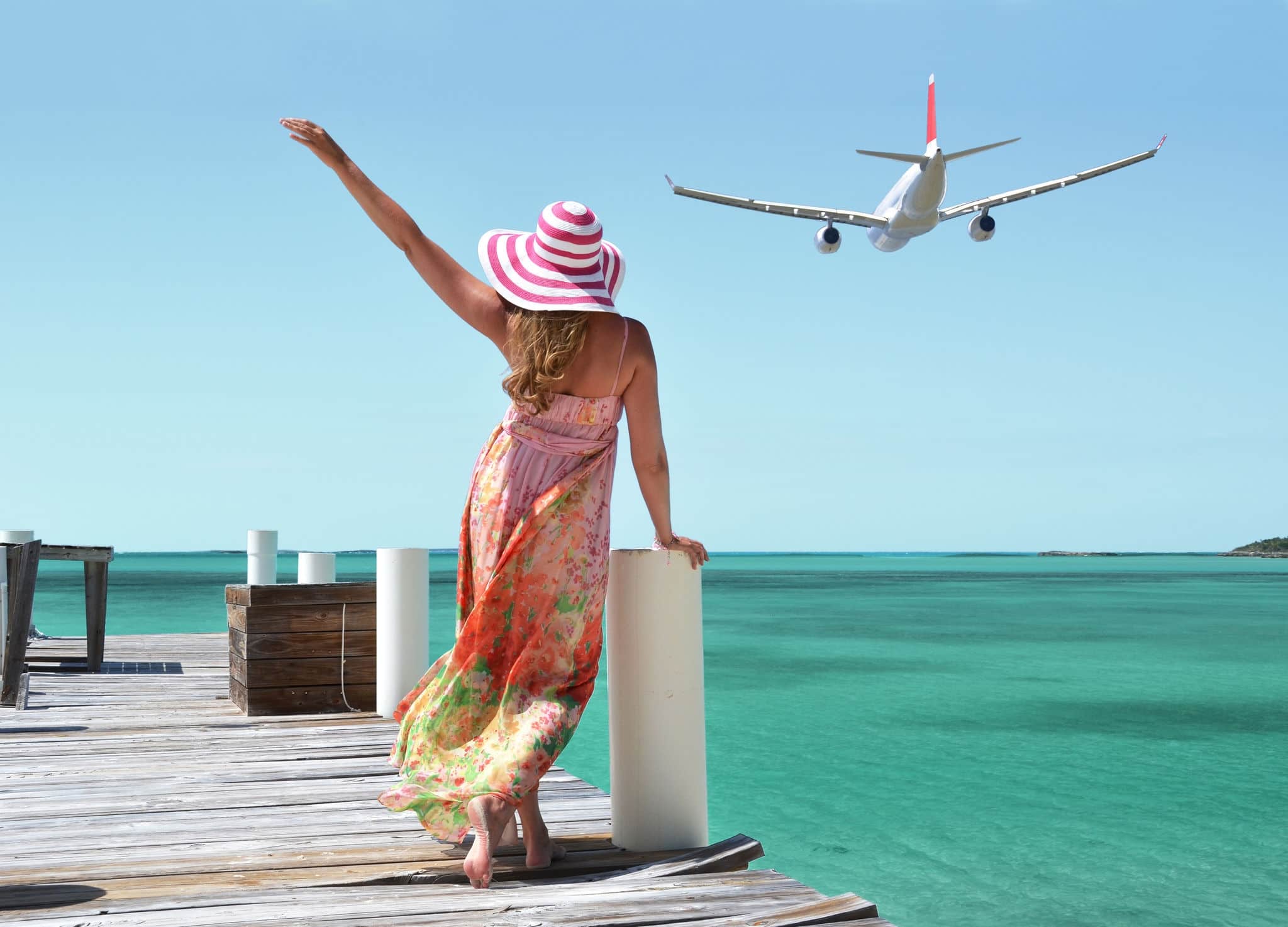 Girl on the wooden jetty. GreatExuma, Bahamas