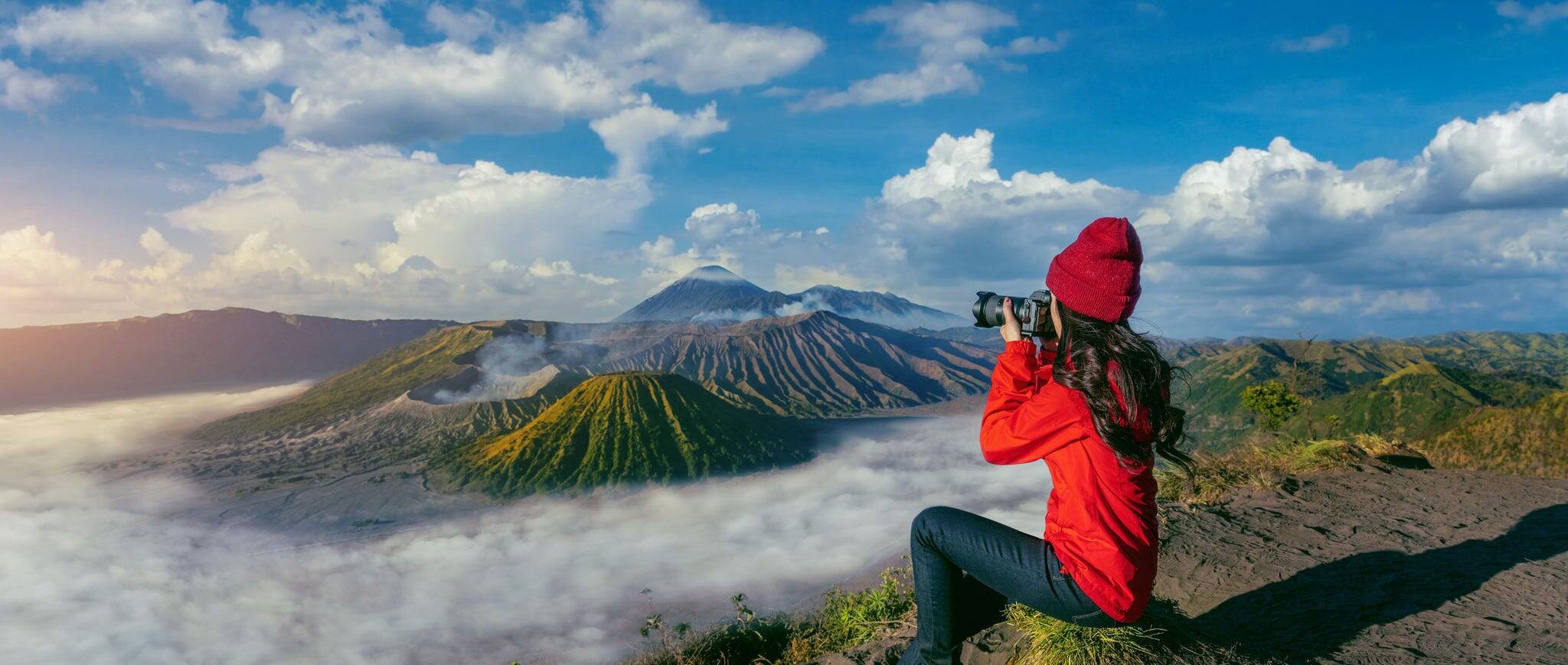 Tourist taking photo at Mount Bromo volcano (Gunung Bromo) in Bromo Tengger Semeru National Park, East Java, Indonesia.