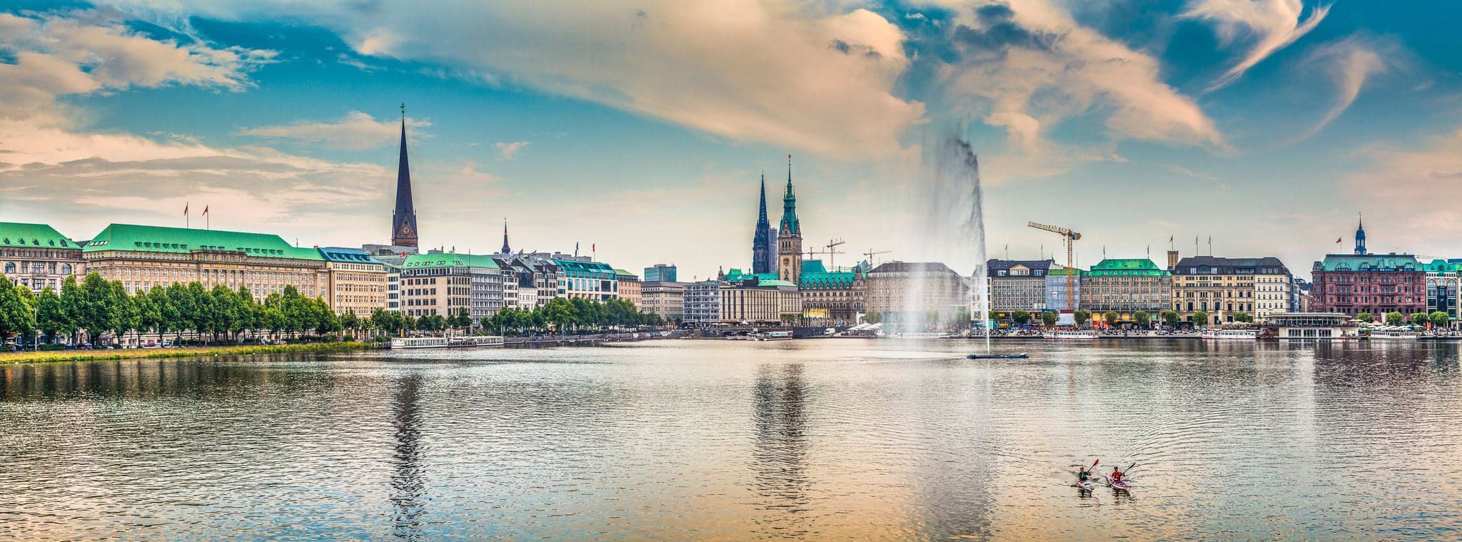 Panoramic view of famous Binnenalster (Inner Alster Lake) in golden evening light at sunset, Hamburg, Germany