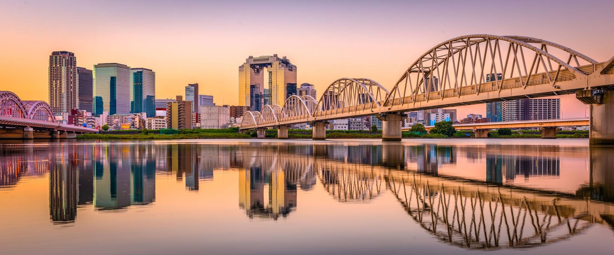 Osaka, Japan Umeda District cityscape panorama on the Yodogawa River.