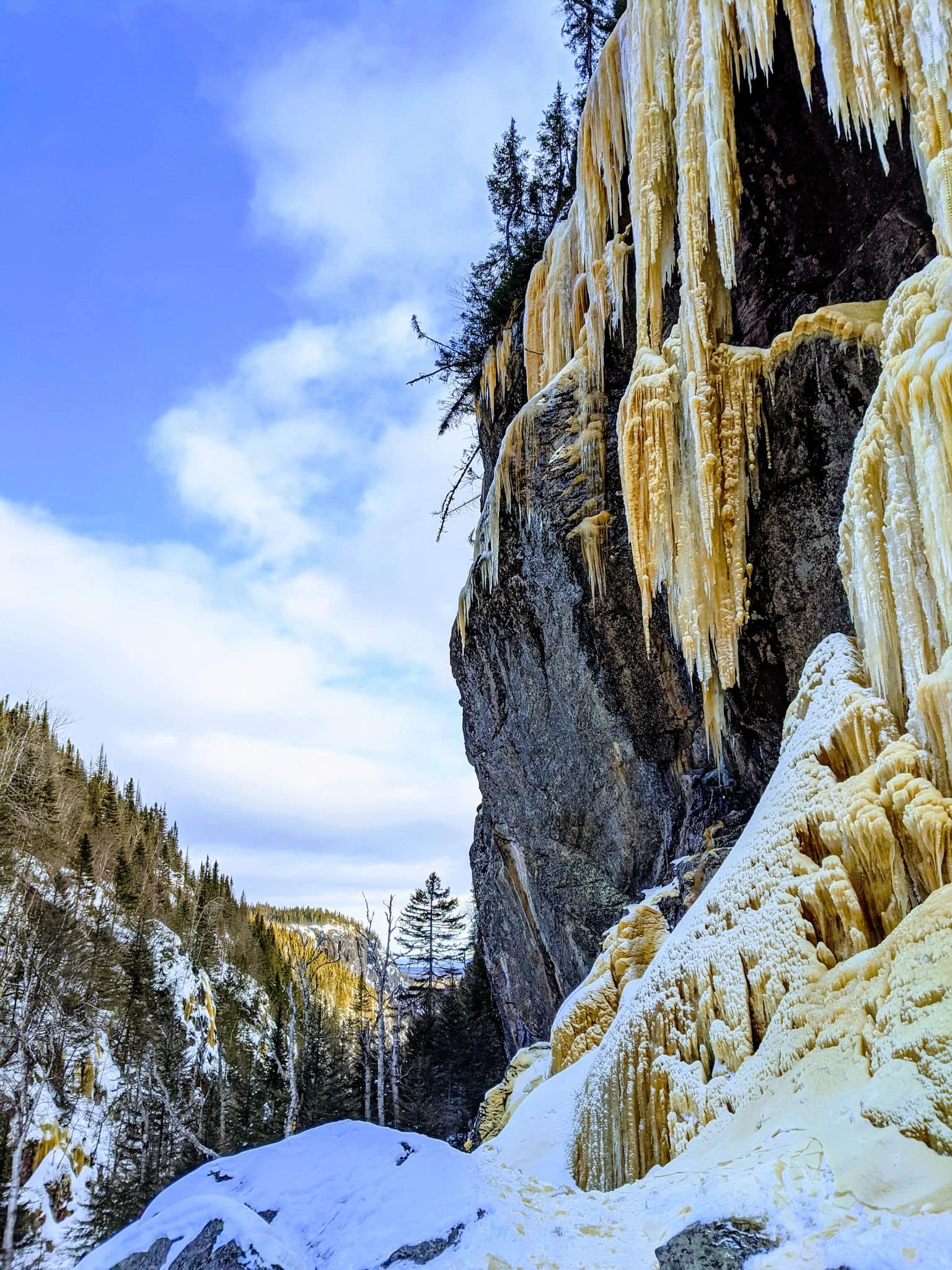 Frozen waterfall known as "frozen palace" in Sept Iles Quebec Canada with beautiful view