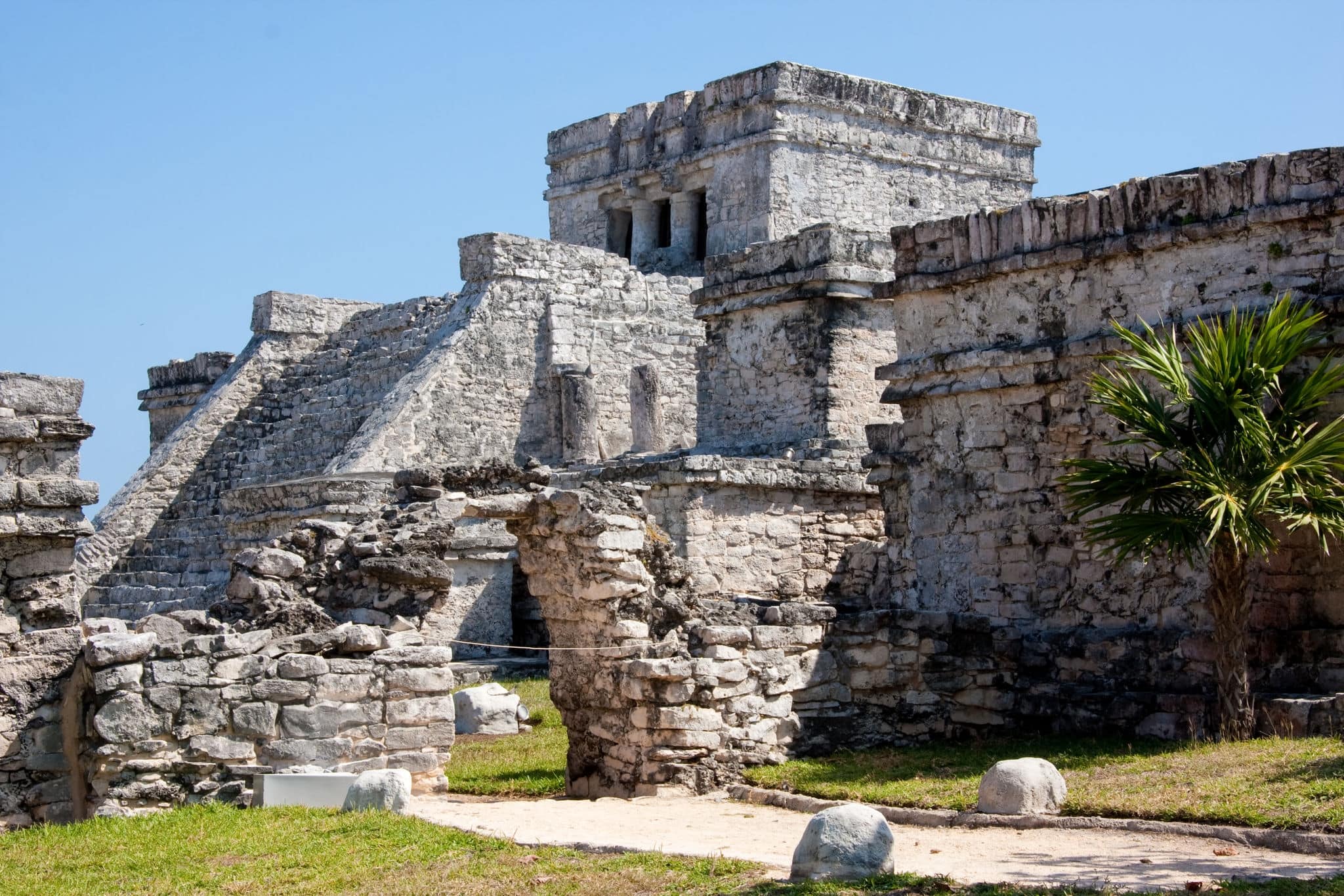 Tulum is one of the best-preserved coastal Maya sites and a popular site for tourists.  El Castillo (the castle), a temple with two columns portraying serpents.