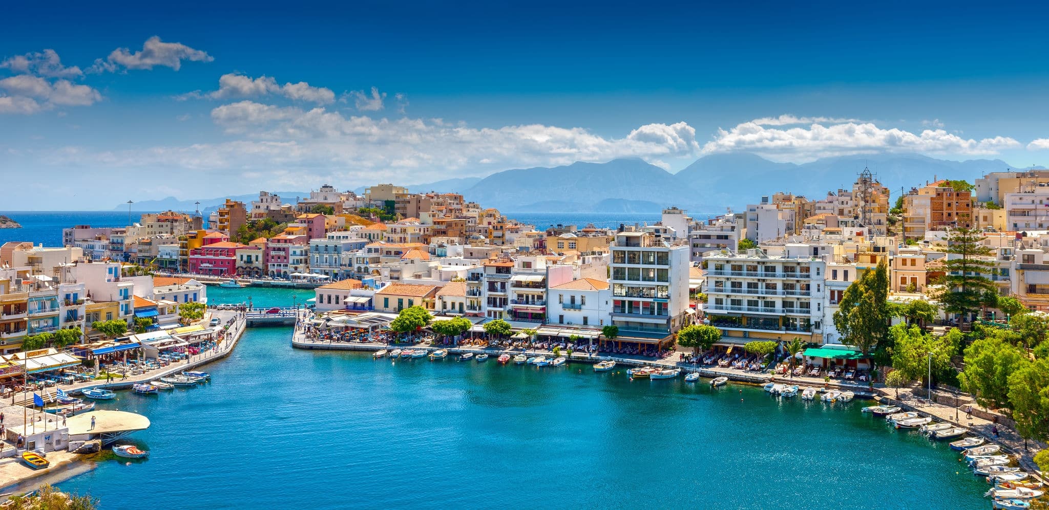 Agios Nikolaos, Crete, Greece. Agios Nikolaos is a picturesque town in the eastern part of the island Crete built on the northwest side of the peaceful bay of Mirabello. 
