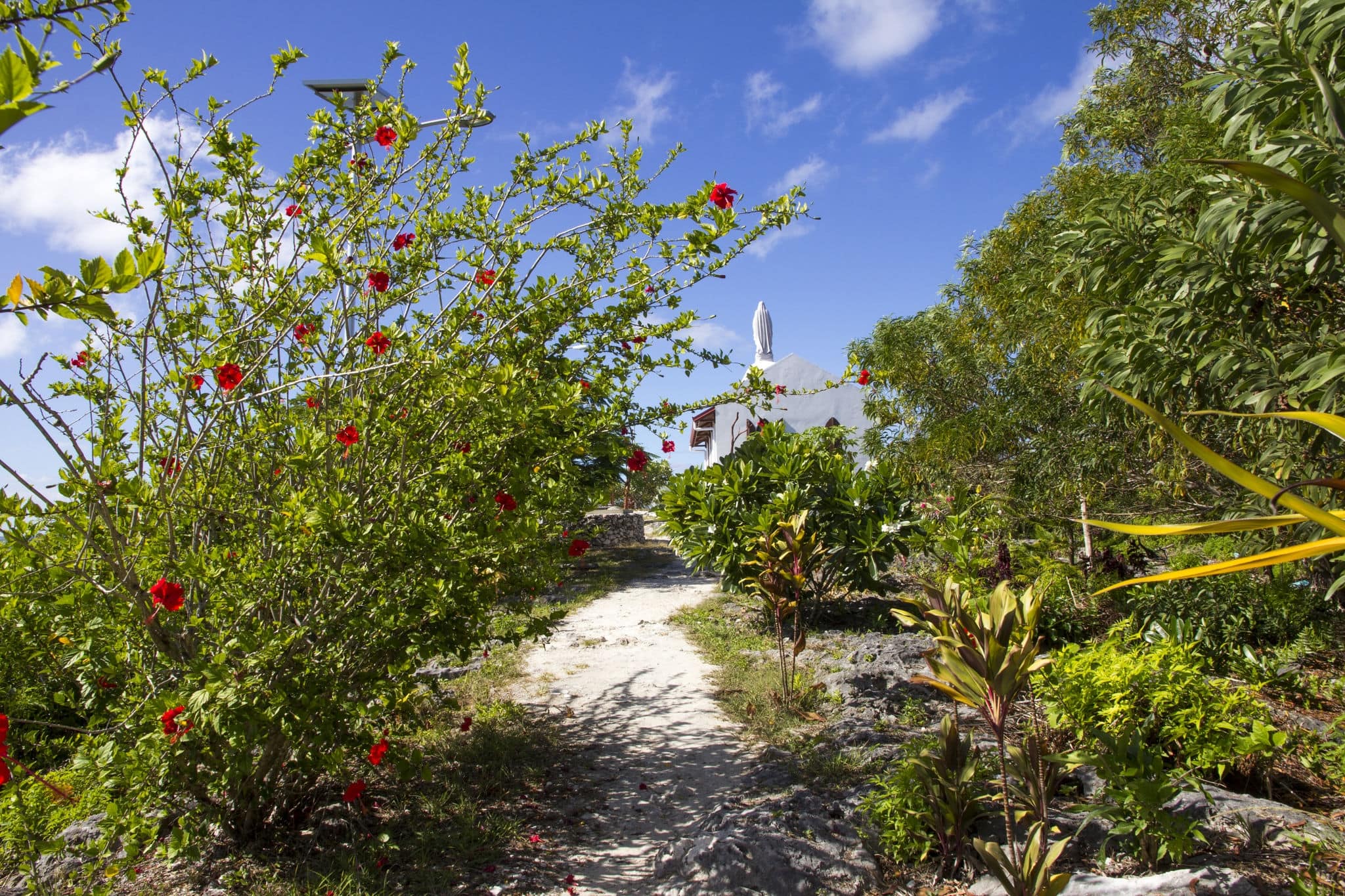 Lifou, New Caledonia. Path leading up to Our Lady of Lourdes Chapel. The chapel was built in 1898 by visiting Catholic missionaries.