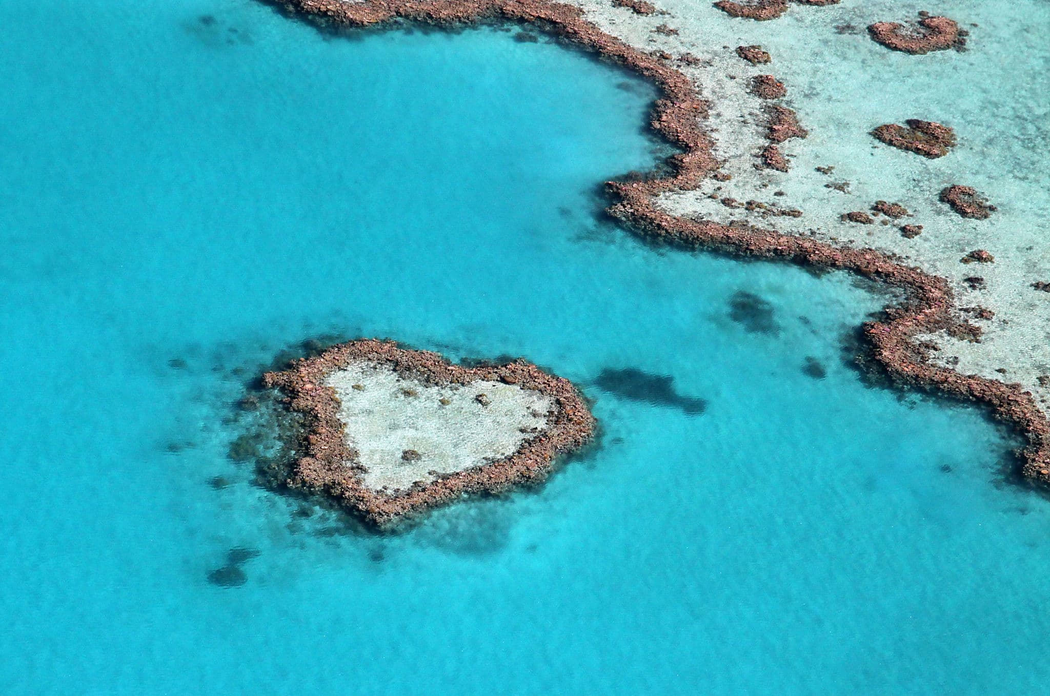 Heart reef impact in the tropical blue ocean