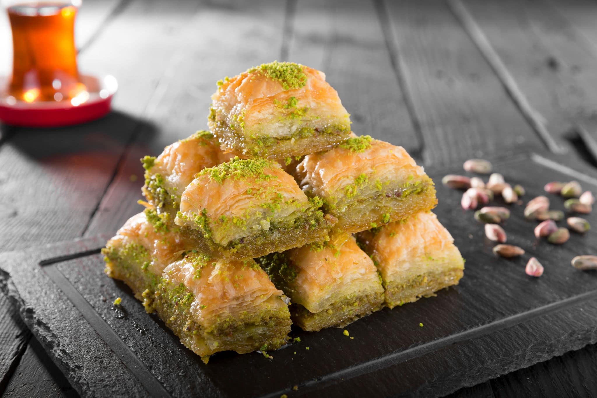 Turkish ramadan dessert Baklava with pistachio and black arabian tea.