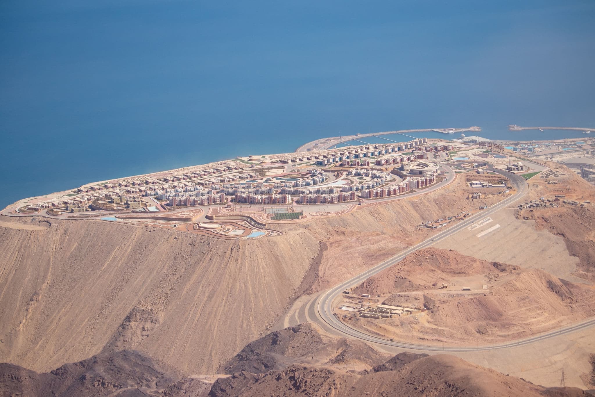 view of a new city galala built on very high mountain with back ground of skies and mountains