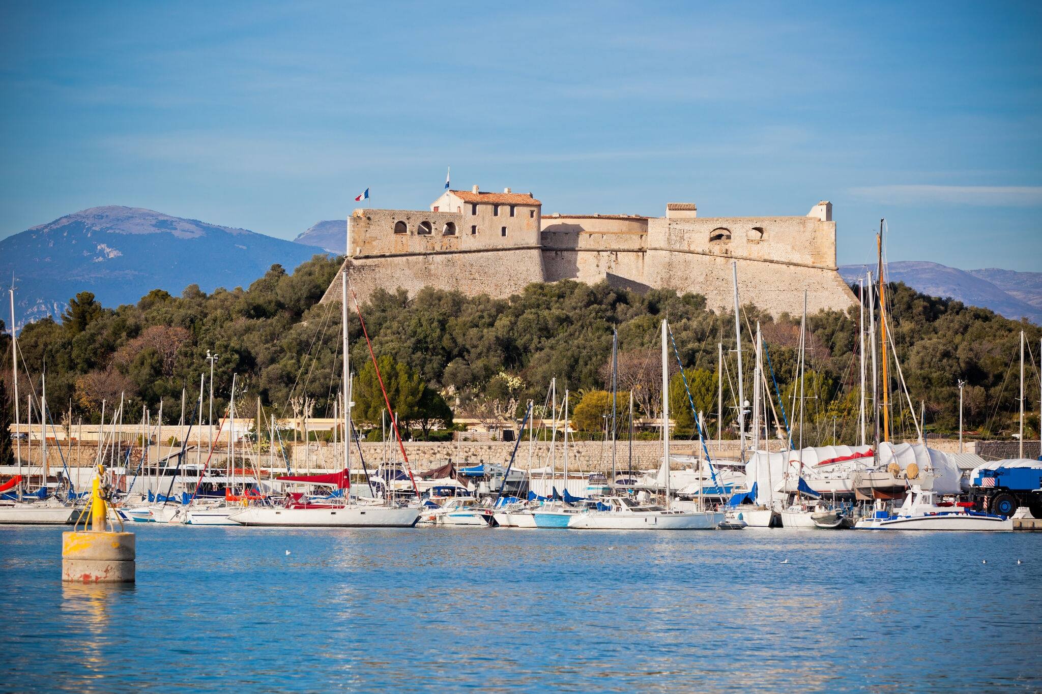 Antibes harbor, France, with yachts and Fort Carre. Horizontal shot