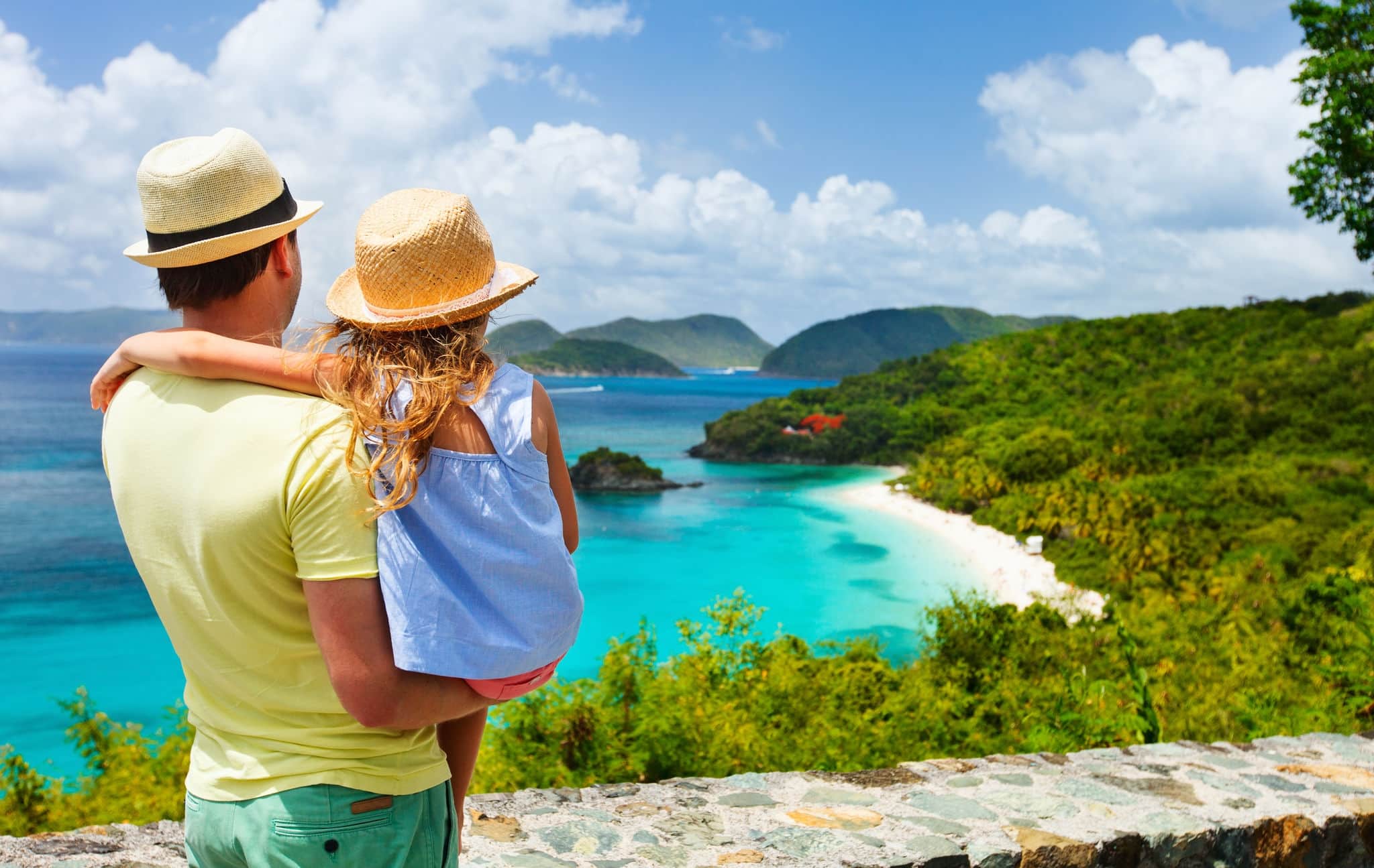 Family of father and daughter enjoying aerial view of picturesque Trunk bay on St John island, US Virgin Islands considered by many as most beautiful beach in Caribbean