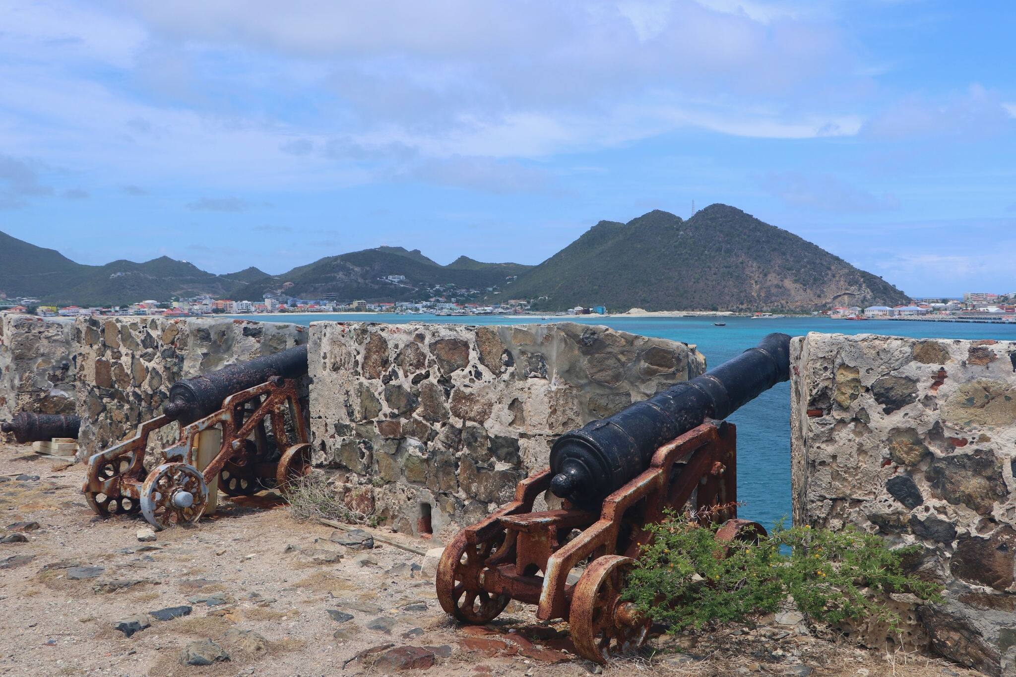 cannons in remains of historic Fort Amsterdam overlooking Philipsburg and Great Bay on the dutch side of caribbean island Sint Maarten