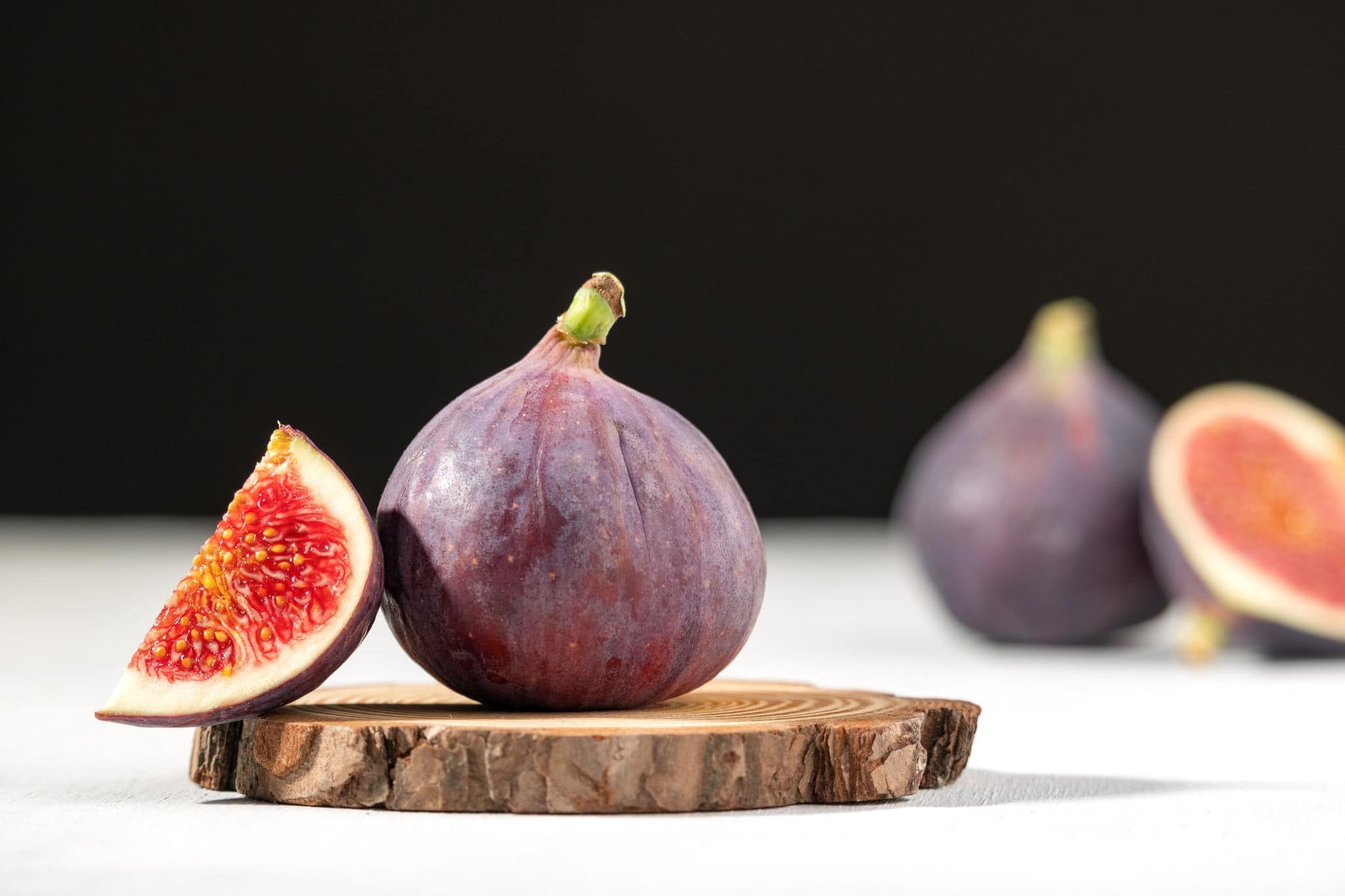 Fresh figs. Halved fig. Juicy fig. Mediterranean fruit.