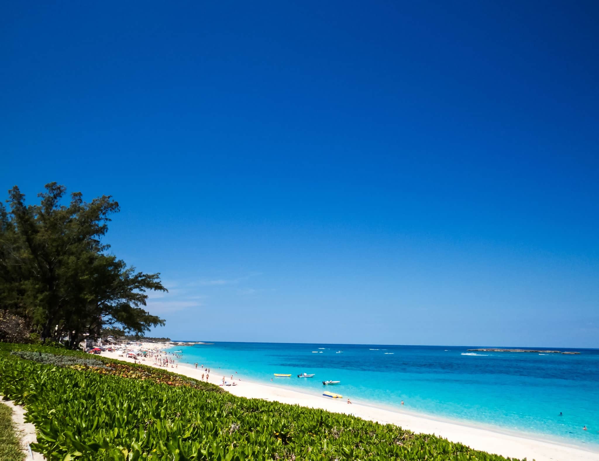 A beautiful view of the ocean and the beach during a bright sunny day.