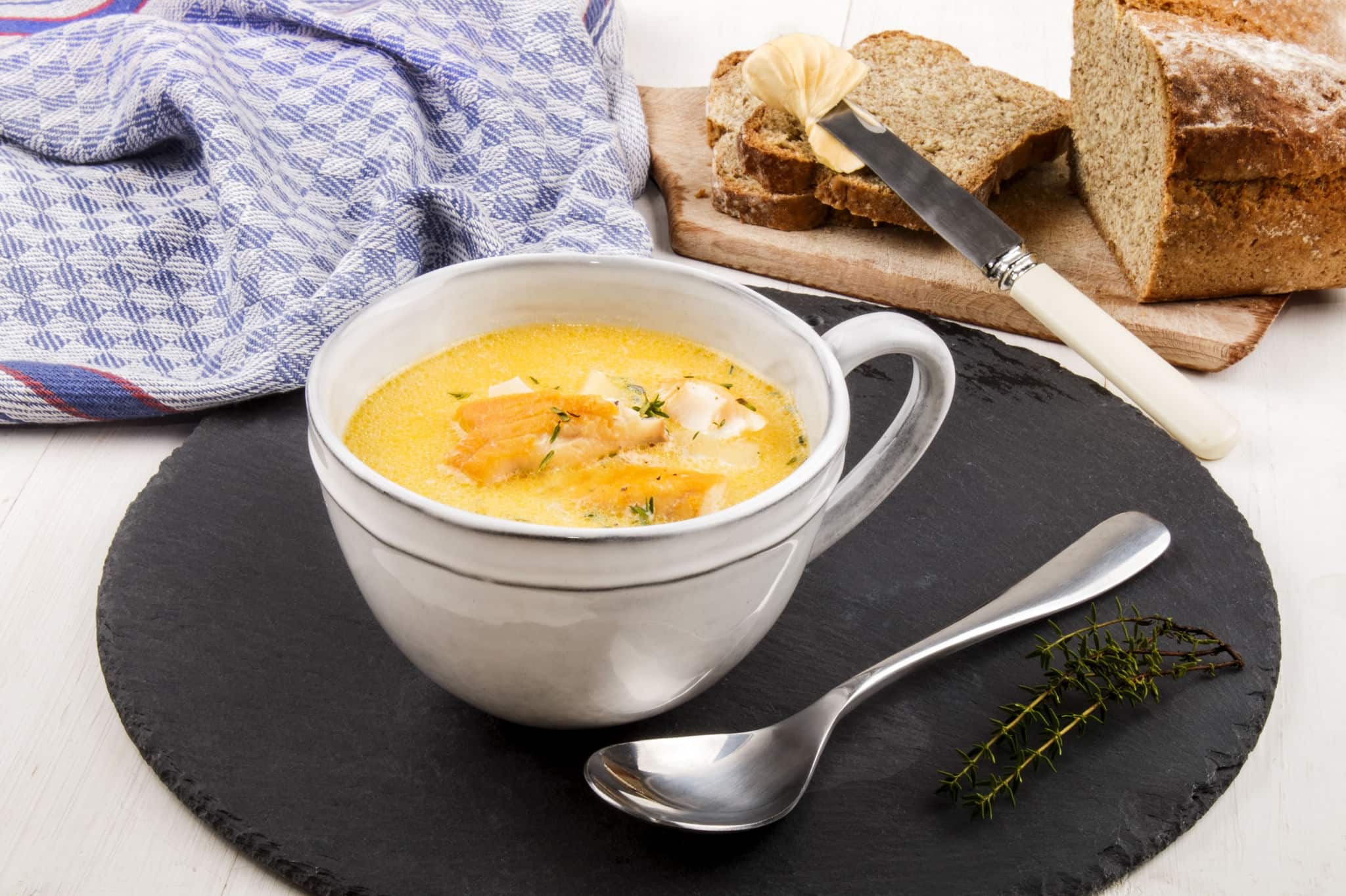 specialty from scotland, freshly cooked cullen skink with thyme in a mug on slate