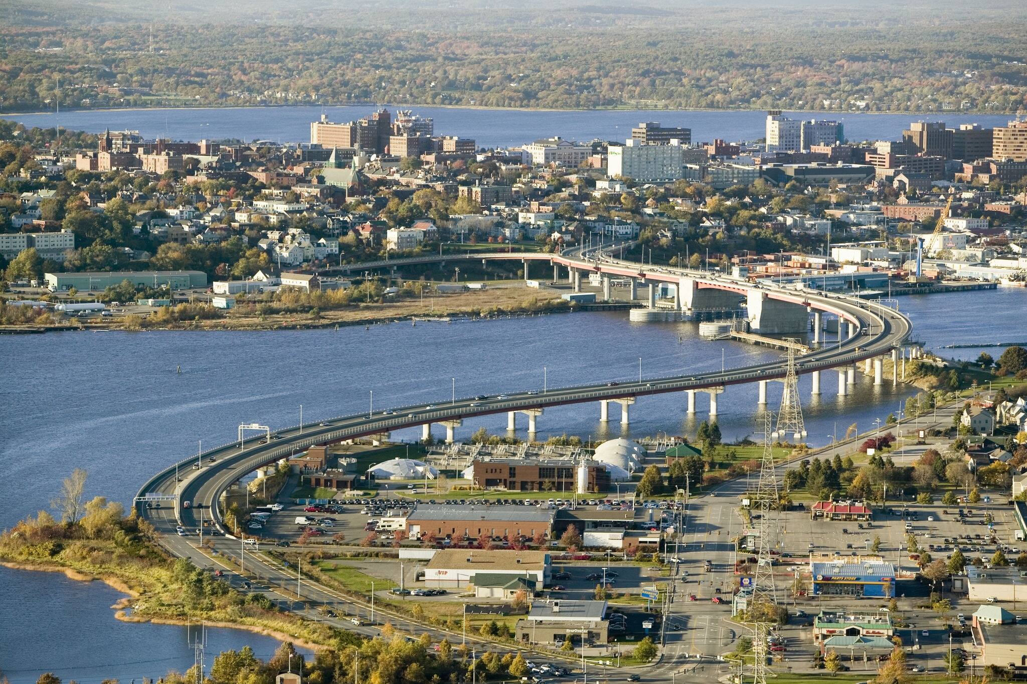 Aerial of downtown Portland, Maine showing Maine Medical Center, Commercial street, Old Port, Back Bay and the Casco Bay Bridge from South Portland