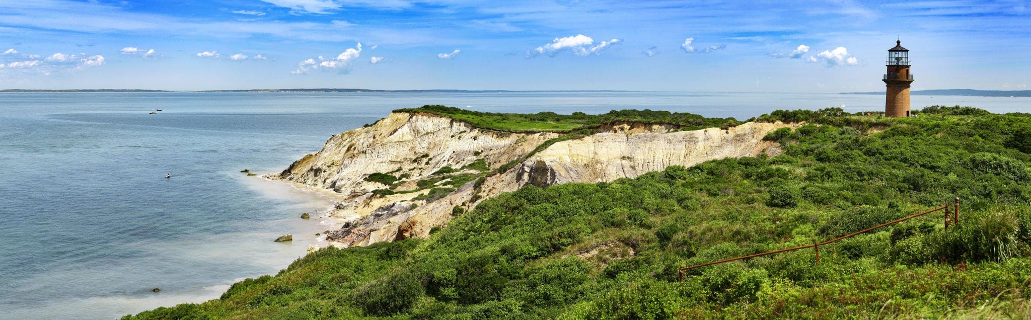 Panorama of a Gay Head lighthouse on a cliff in Aquinnah, Marthas Wineyard