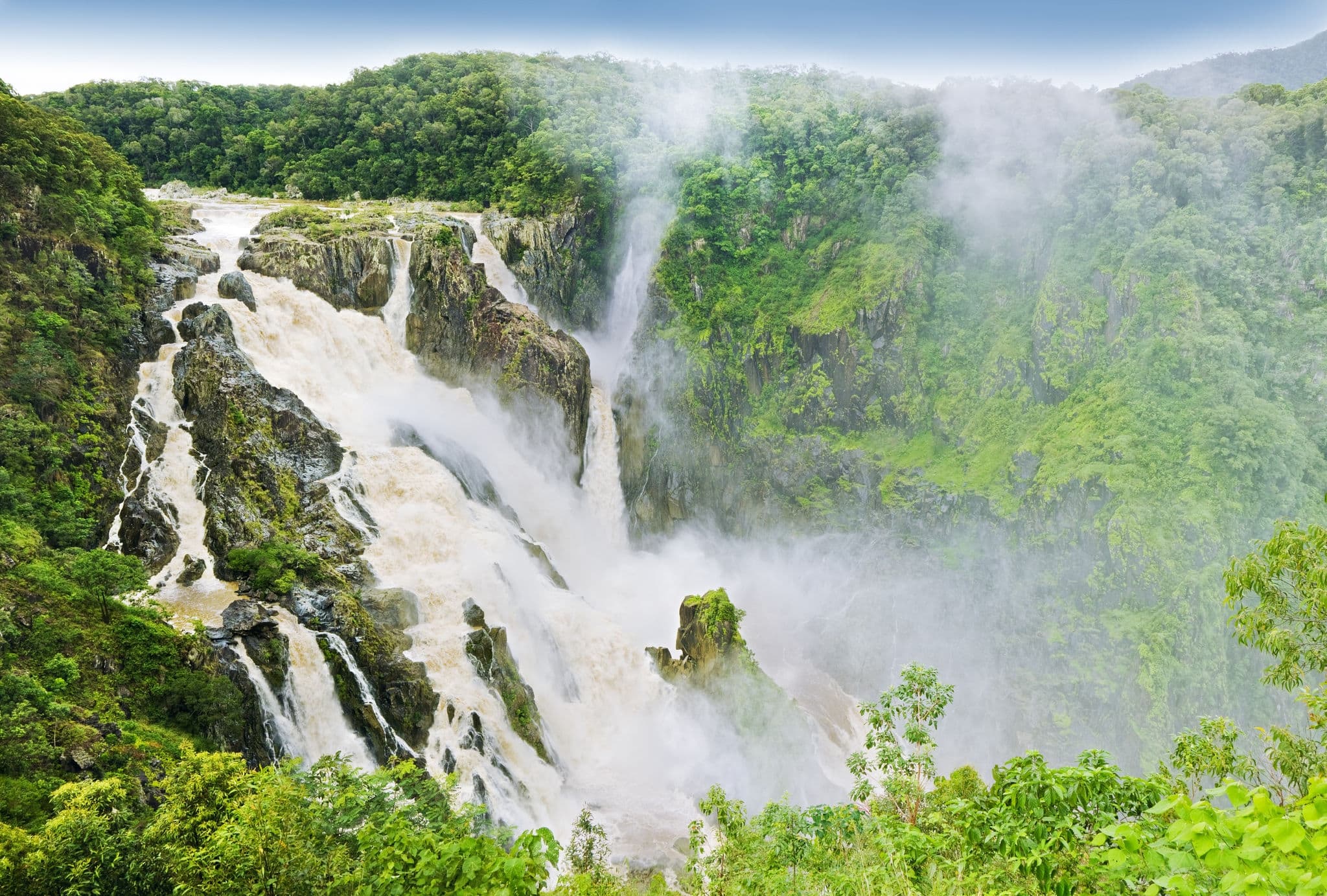 The Barron Falls - massive waterfall in Australia surrounded by tropical rainforest