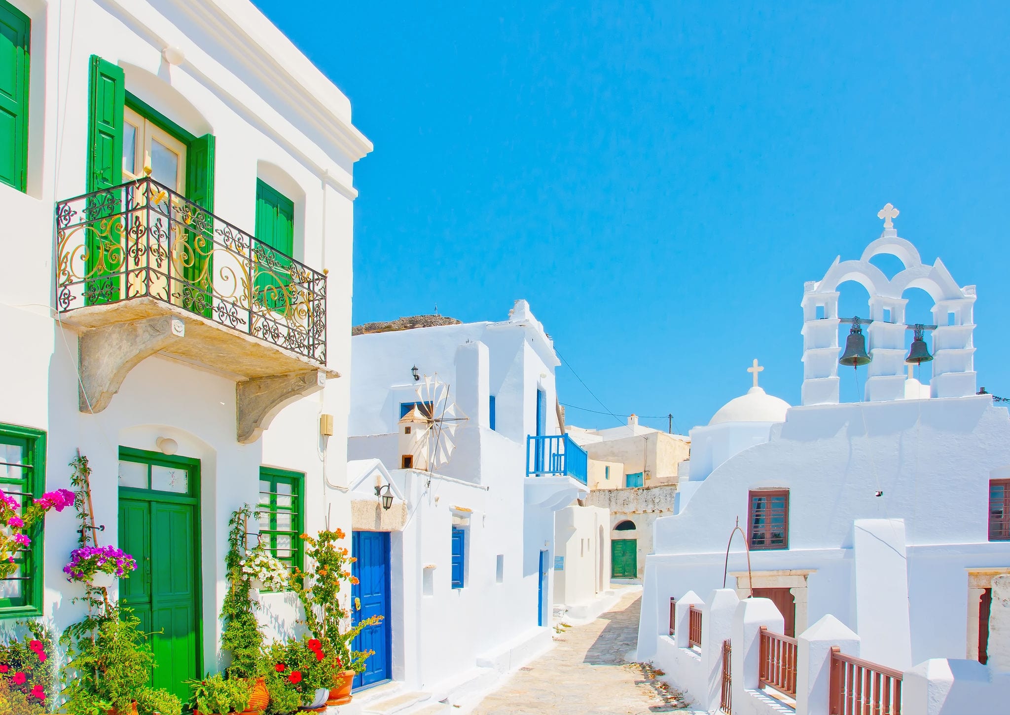 Beautiful stone made road with old traditional houses and a twin church in Chora the capital of Amorgos island in Greece