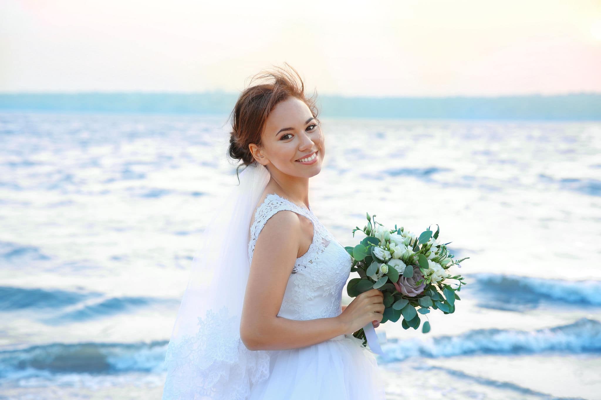 Beautiful bride on bank of river