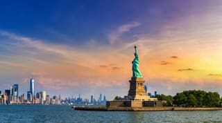 Panorama of  Statue of Liberty against Manhattan cityscape background in New York City, NY, USA