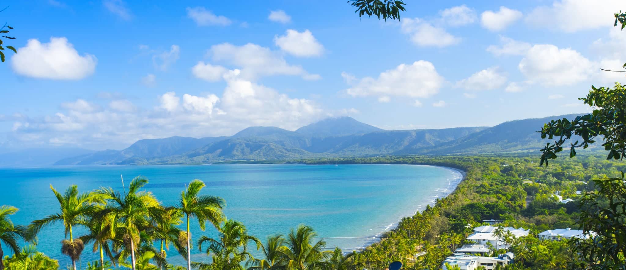 Four Mile Beach in Port Douglas in Tropical North Queensland with blue water