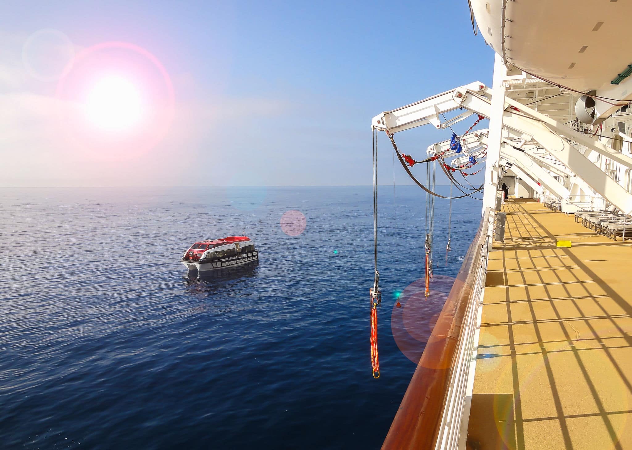 Cruise ship and tender boat on the ocean 