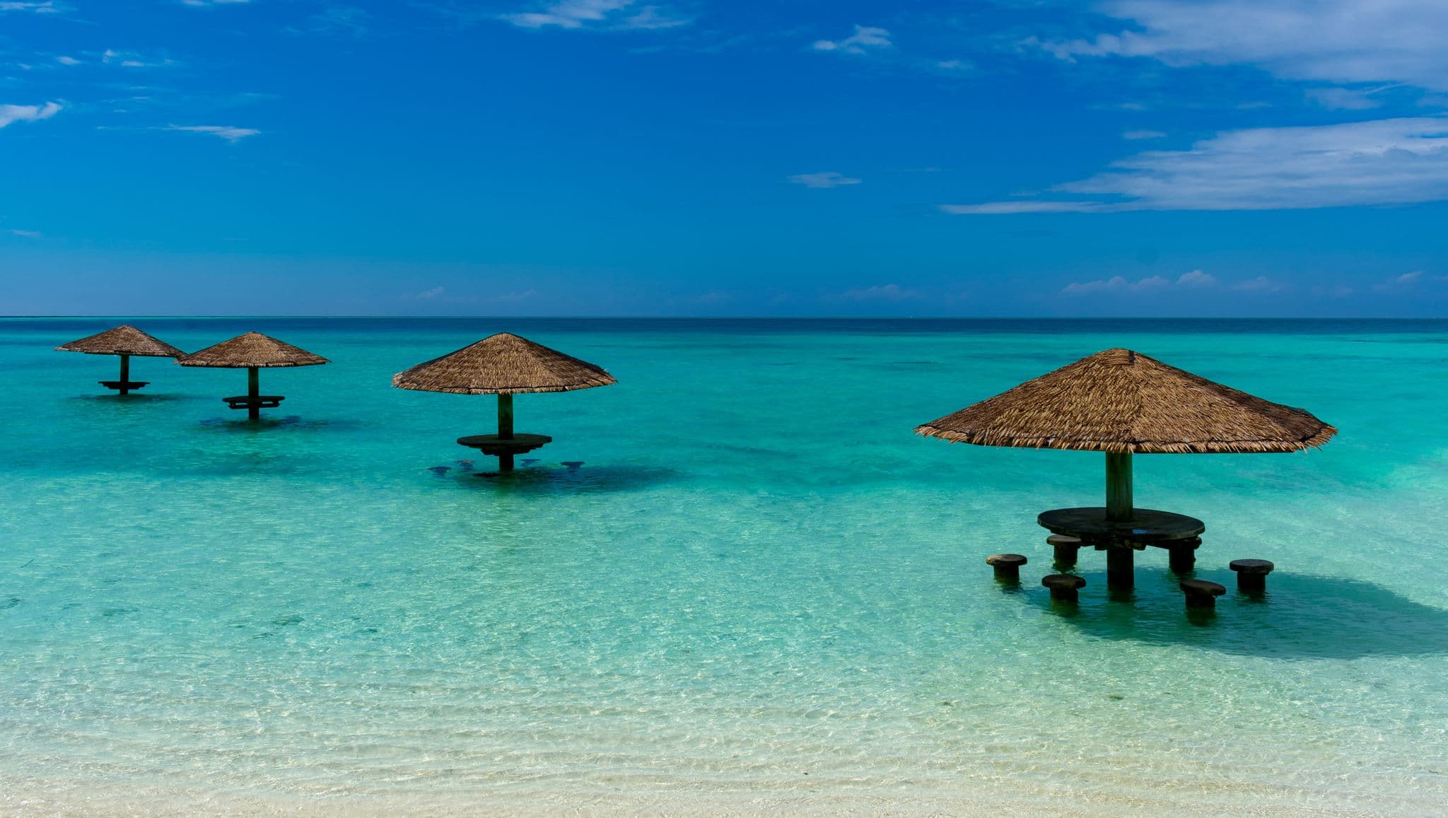 Umbrellas on the water in the Maldives