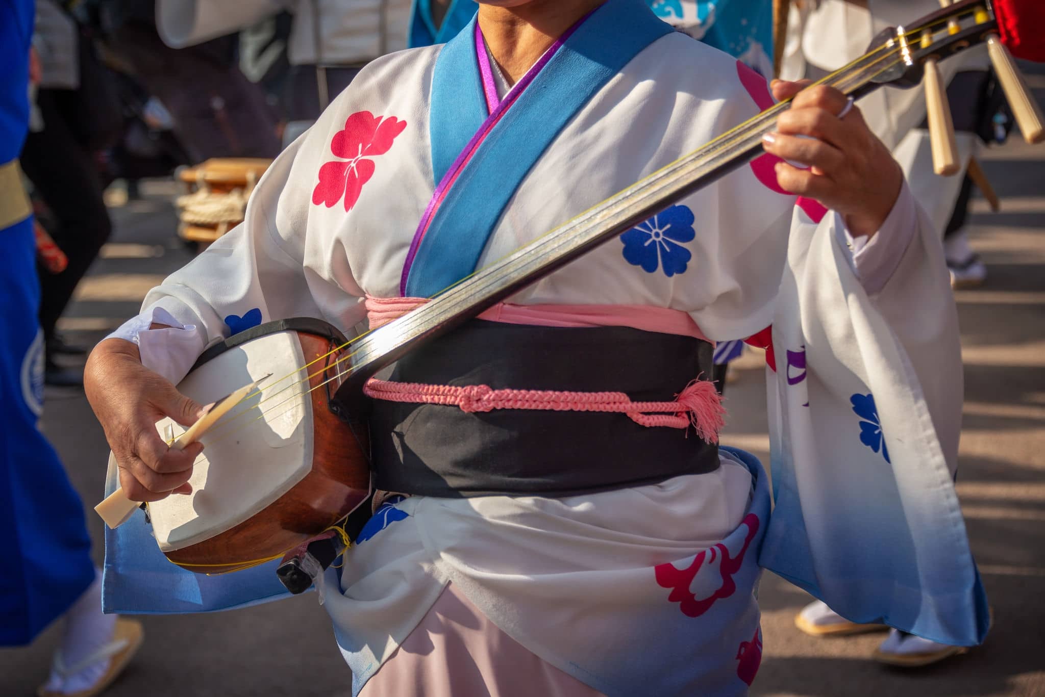 Woman playing shamisen on Awa Odori traditional japanese dance festival