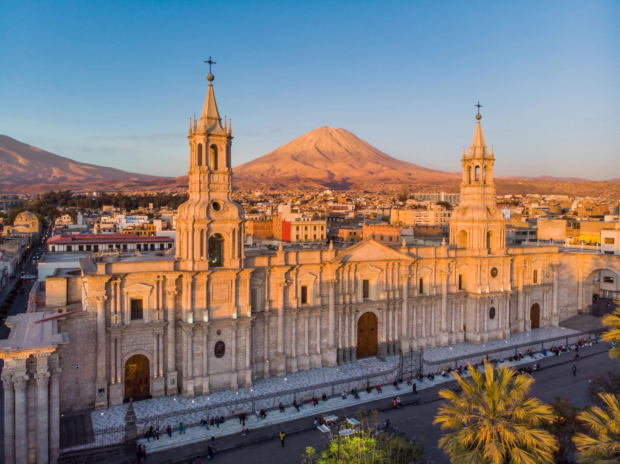 Aerial view of the cathedral of Arequipa Peru at sunset with the background of the Misti volcano
