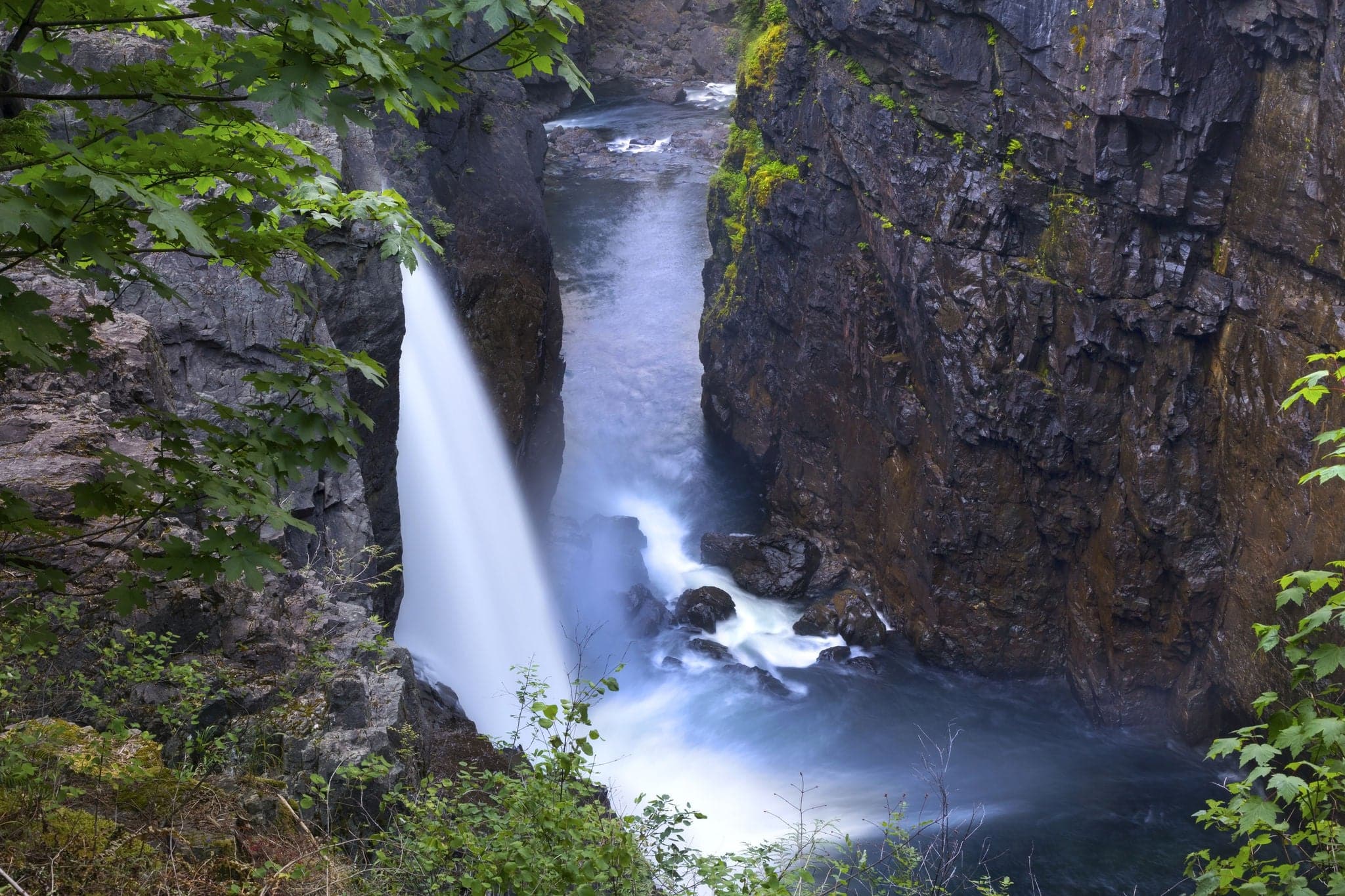 Scenic Landscape View of High Waterfall Water Stream Cascade Flowing in Rock Canyon. Elk Falls Provincial Nature Park, Vancouver Island, British Columbia Canada