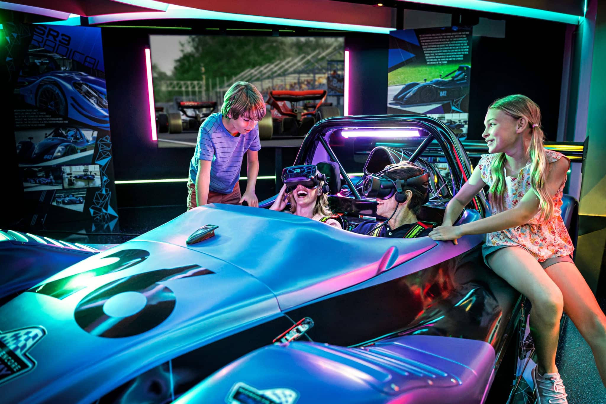 Family having fun with virtual reality car racing