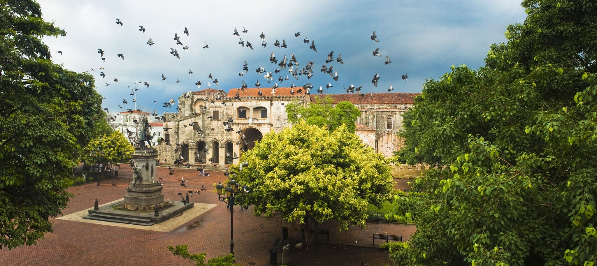 Doves flying over main square, Santo Domingo, Dominican Republic