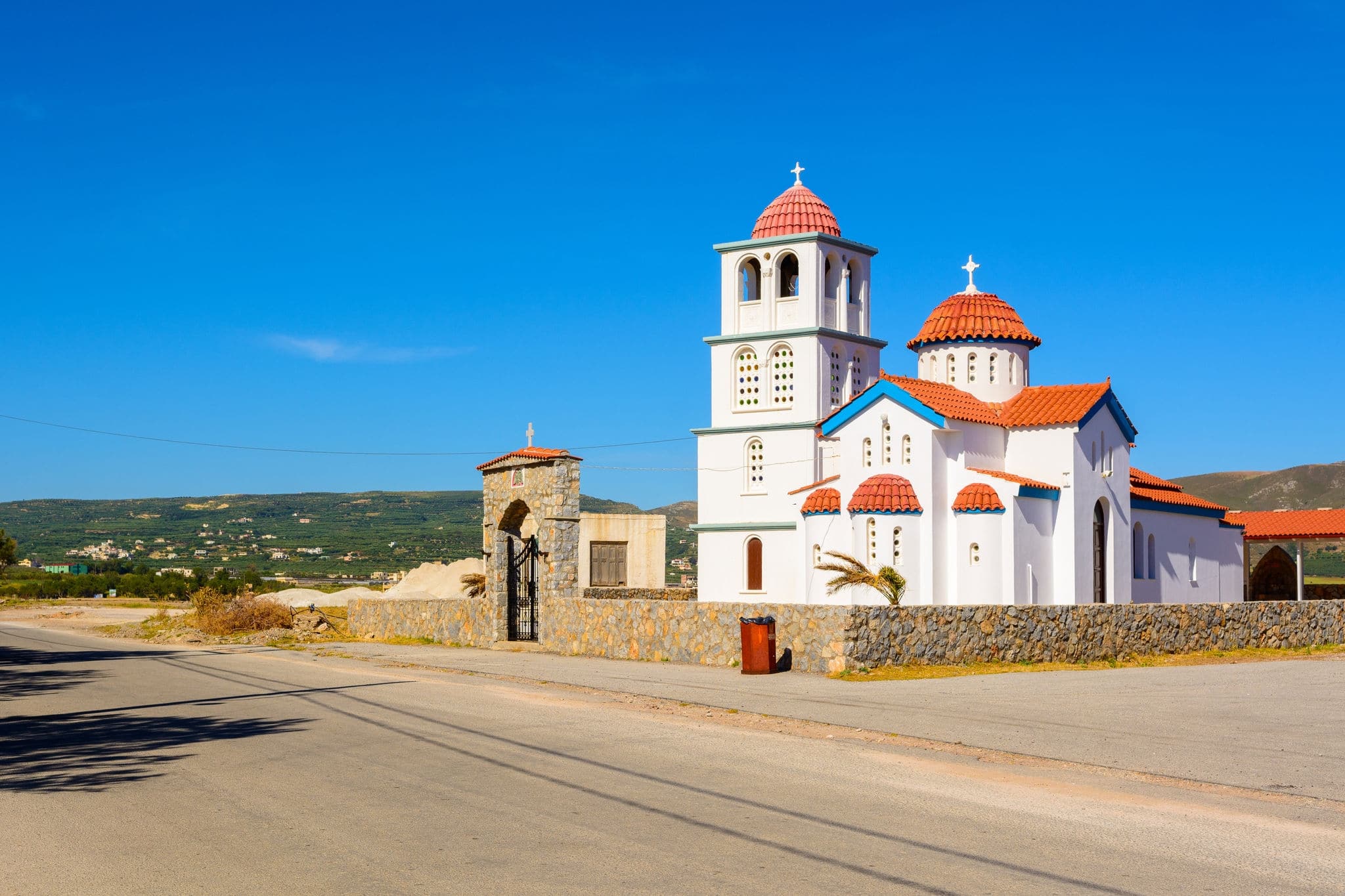 Typical beautiful Greek white church at Kissamos harbor, Crete.  District of Chania. Greece.
