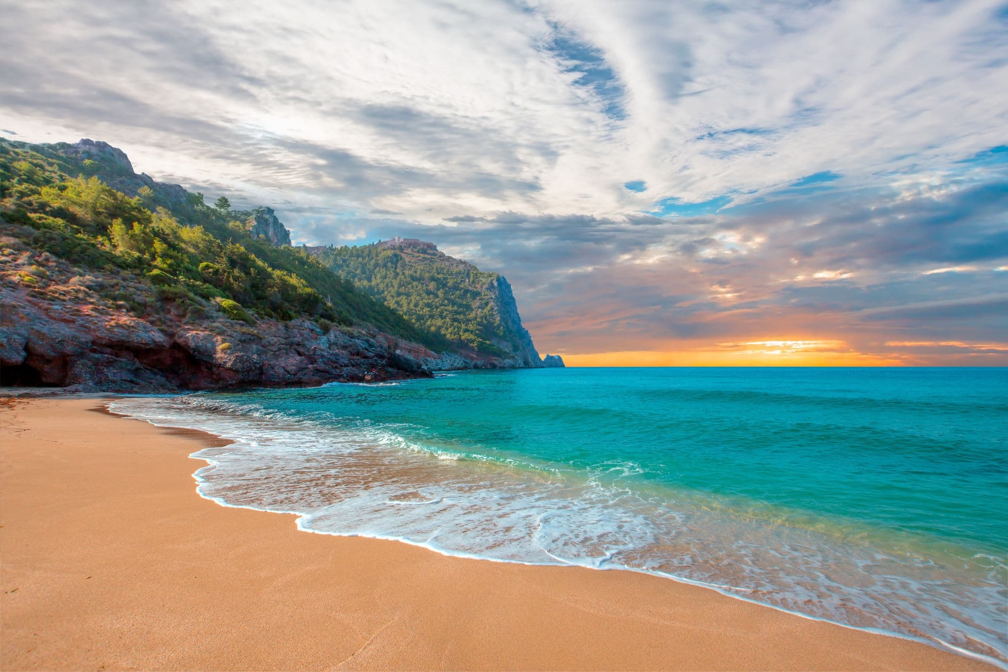 Beach of Cleopatra with sea and rocks of Alanya peninsula - Antalya, Turkey 