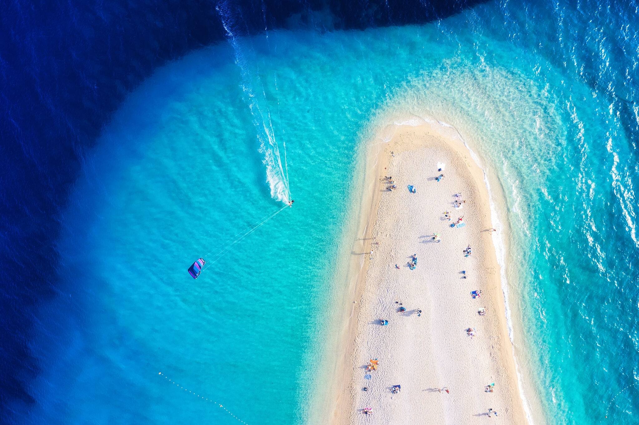 Croatia, Hvar island. Aerial view on the beach and windsurfer. Beach and sea from air. Famous place in Croatia. Summer seascape from drone. Travel - image