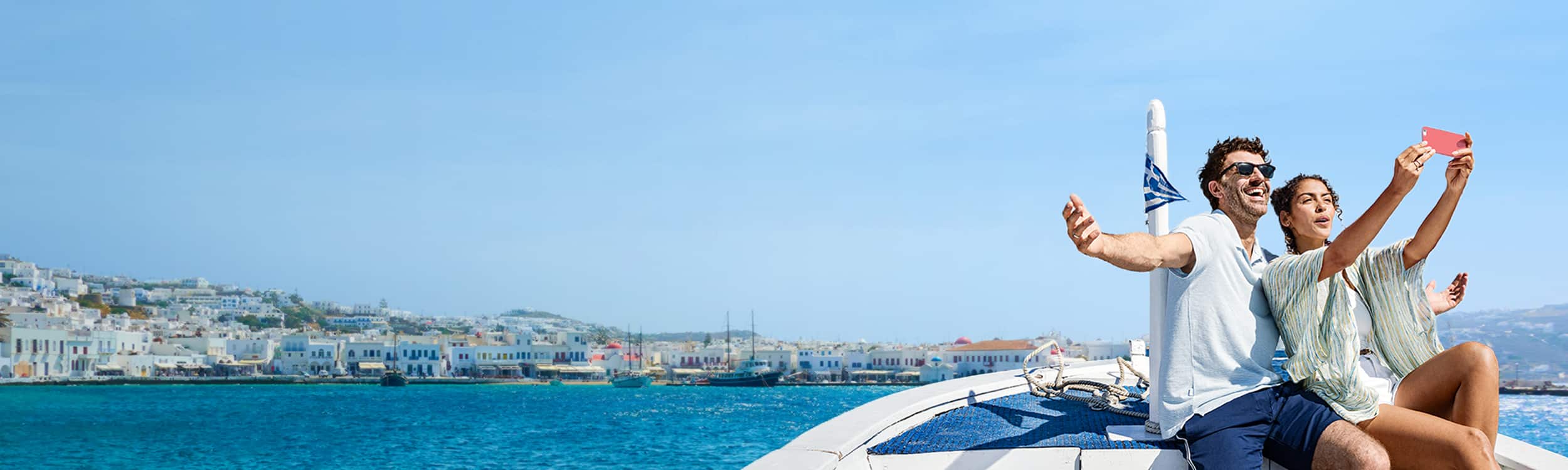 Couple on a boat in Mykonos