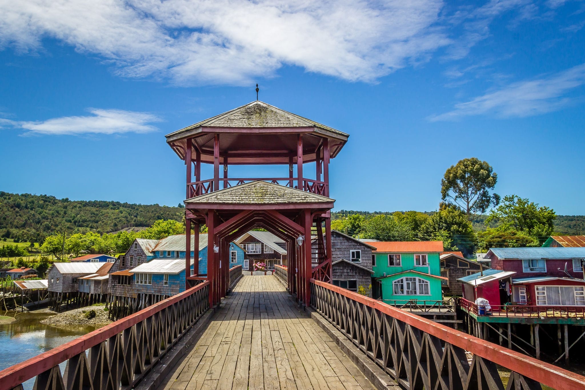 A Wooden Bridge and a Picturesque View of the Traditional Stilt Houses on the Island of Chiloe, Chile