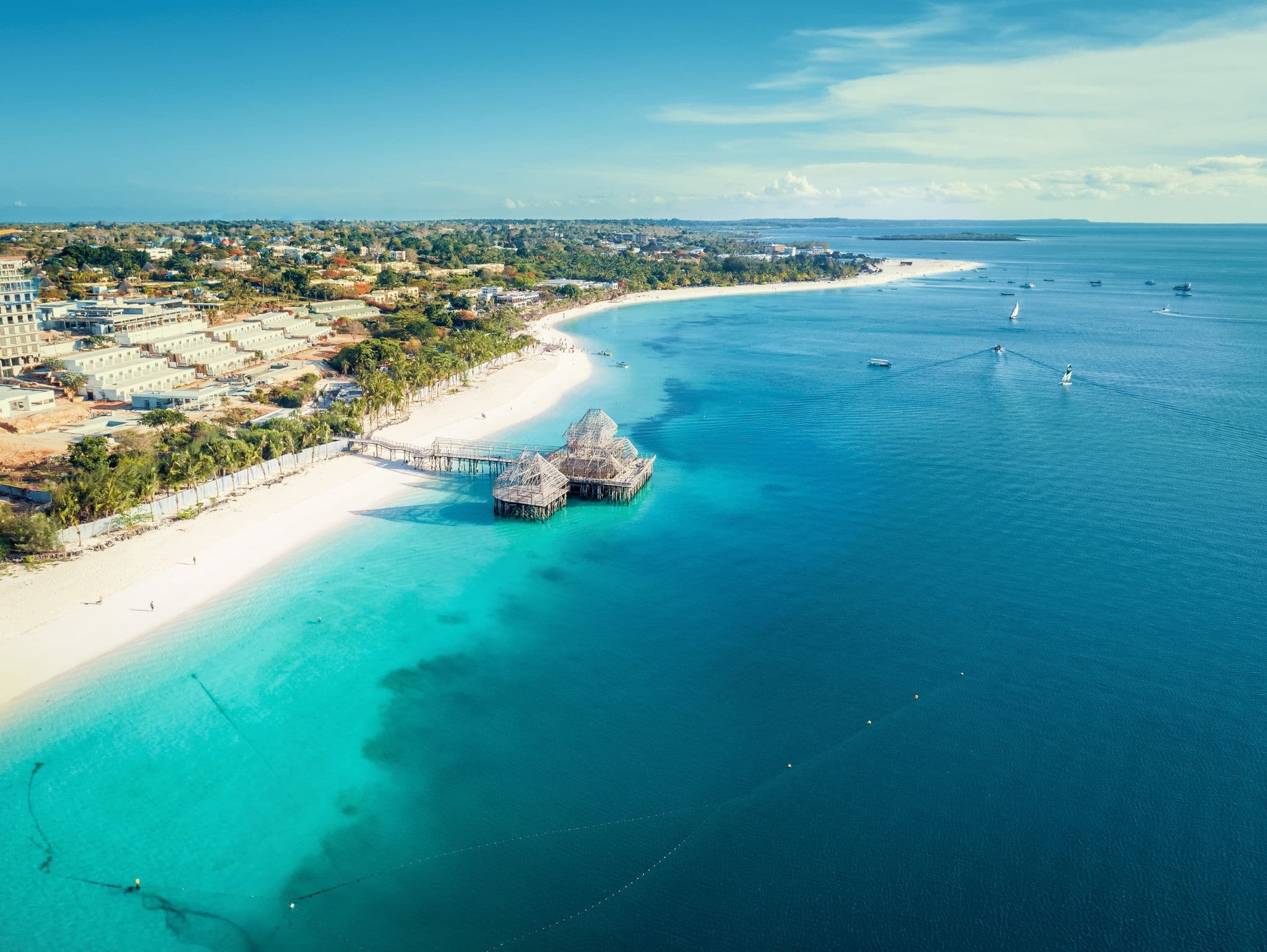 Aerial view of Kendwa beach in Zanzibar, Tanzania with luxury resort and turquoise ocean water. Toned image.