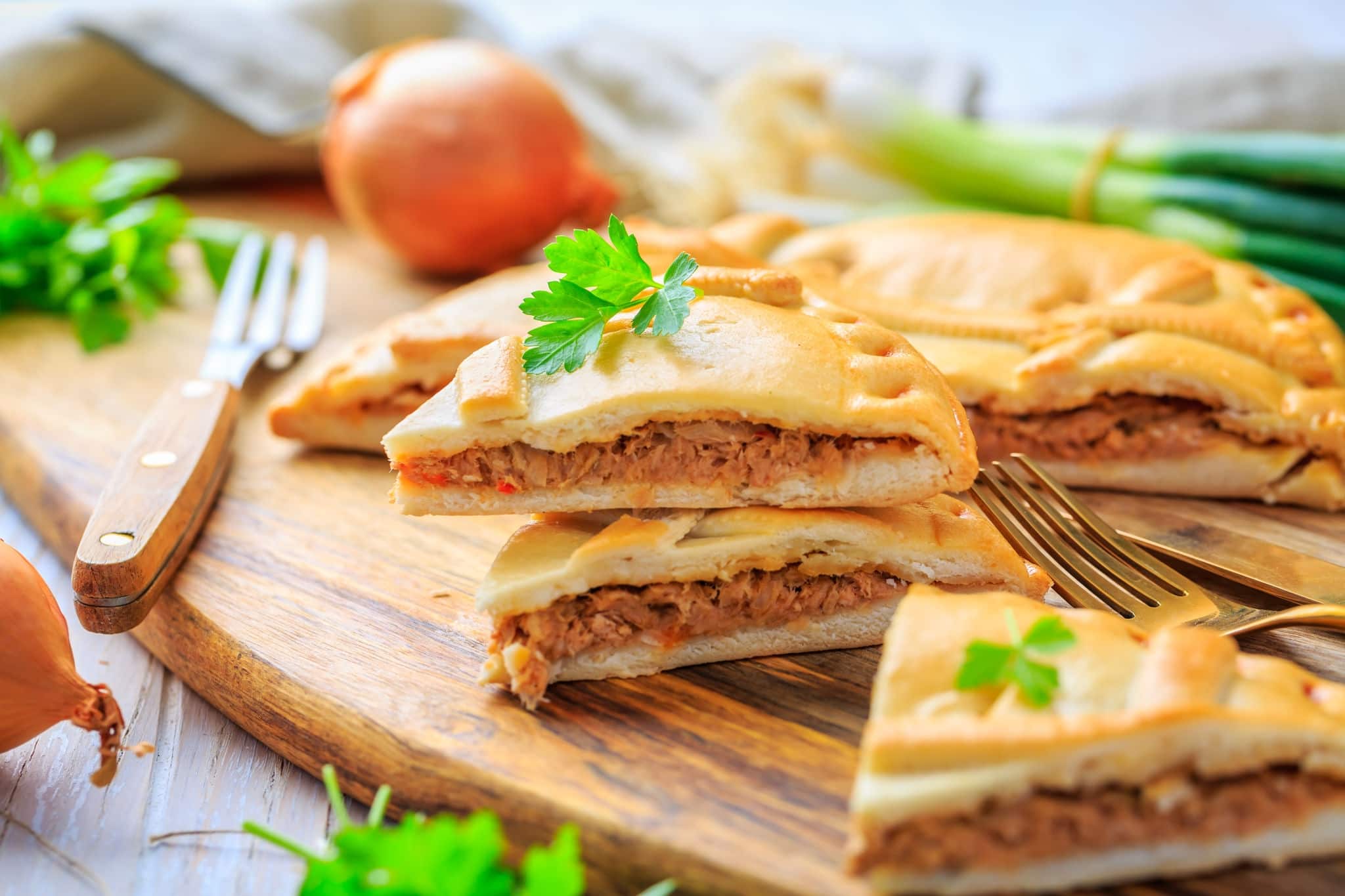 Empanada Gallega - traditional pie stuffed with tuna, Galician and Spanish cuisine. Tart with tuna and vegetables.