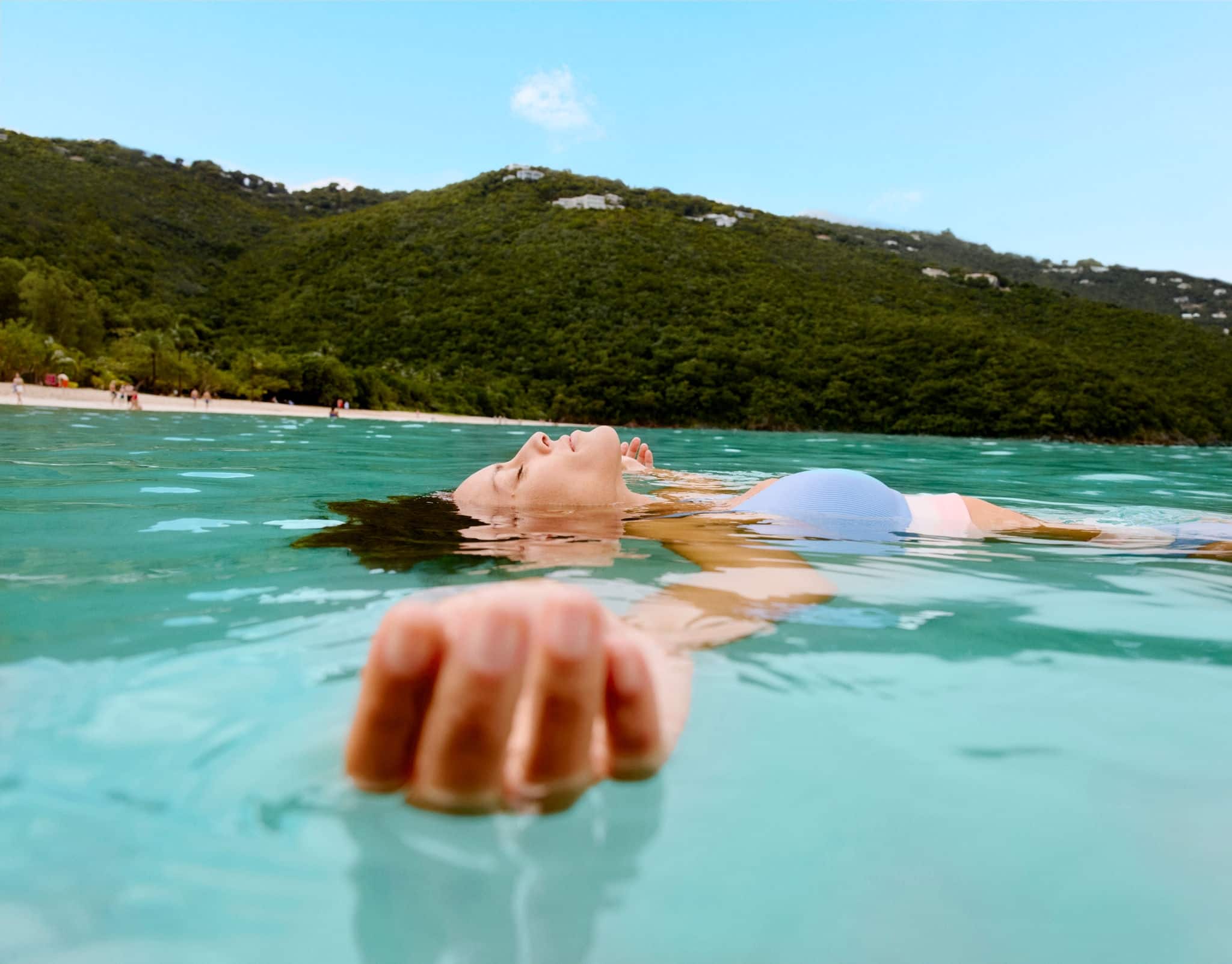 Woman floating in water.