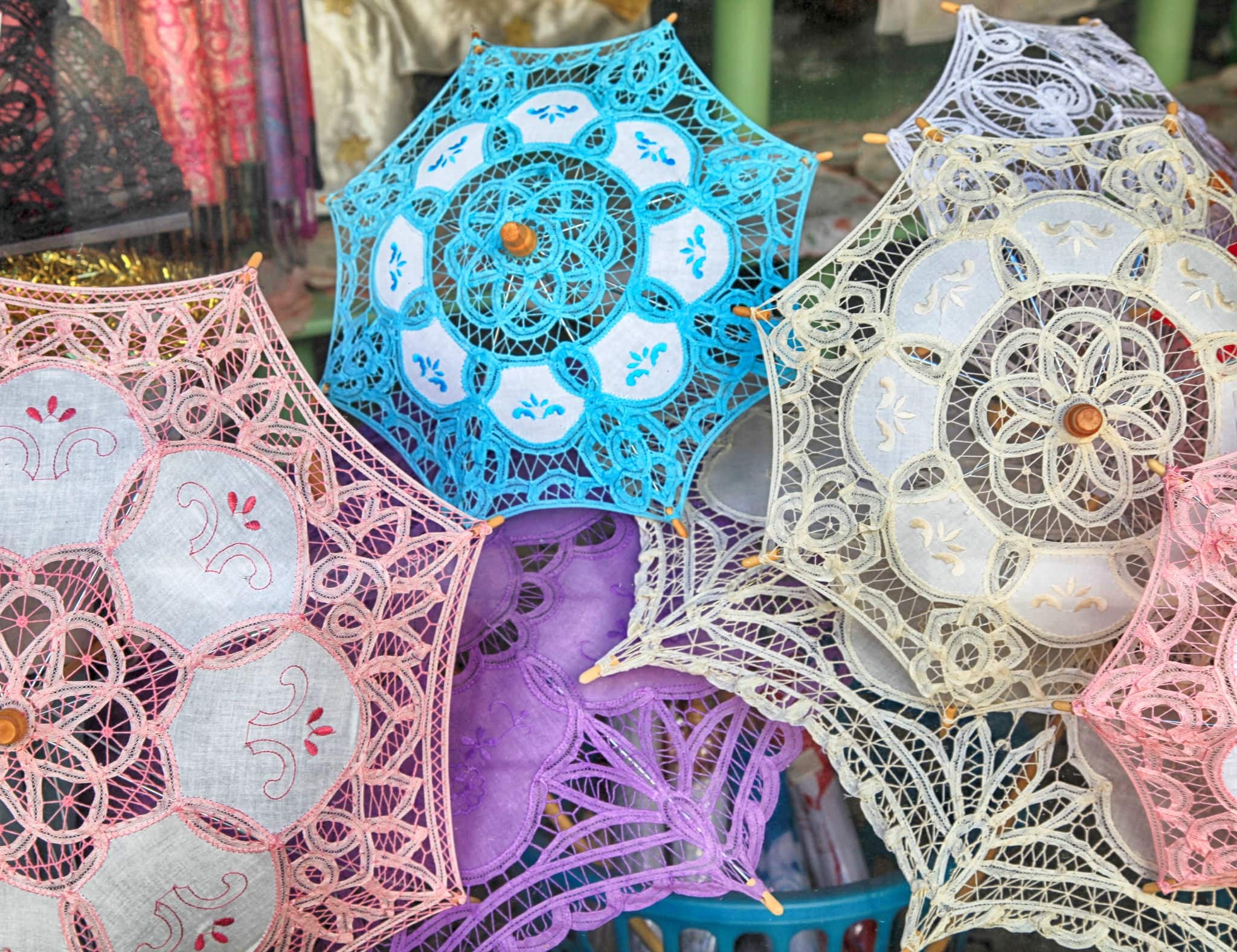 traditional handmade lace umbrellas in local souvenir shop in Lefkara, Cyprus
