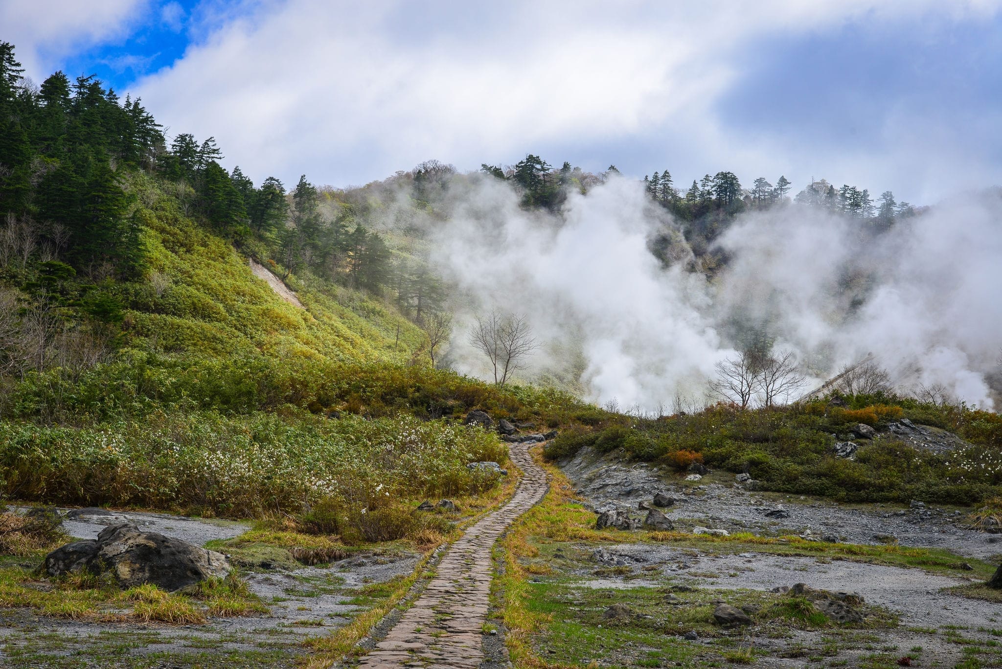 View of Tamagawa Hot Spring at sunny day in Akita, Japan. Tamagawa is the highest flow rate hot spring, it has the most acidic water in Japan.