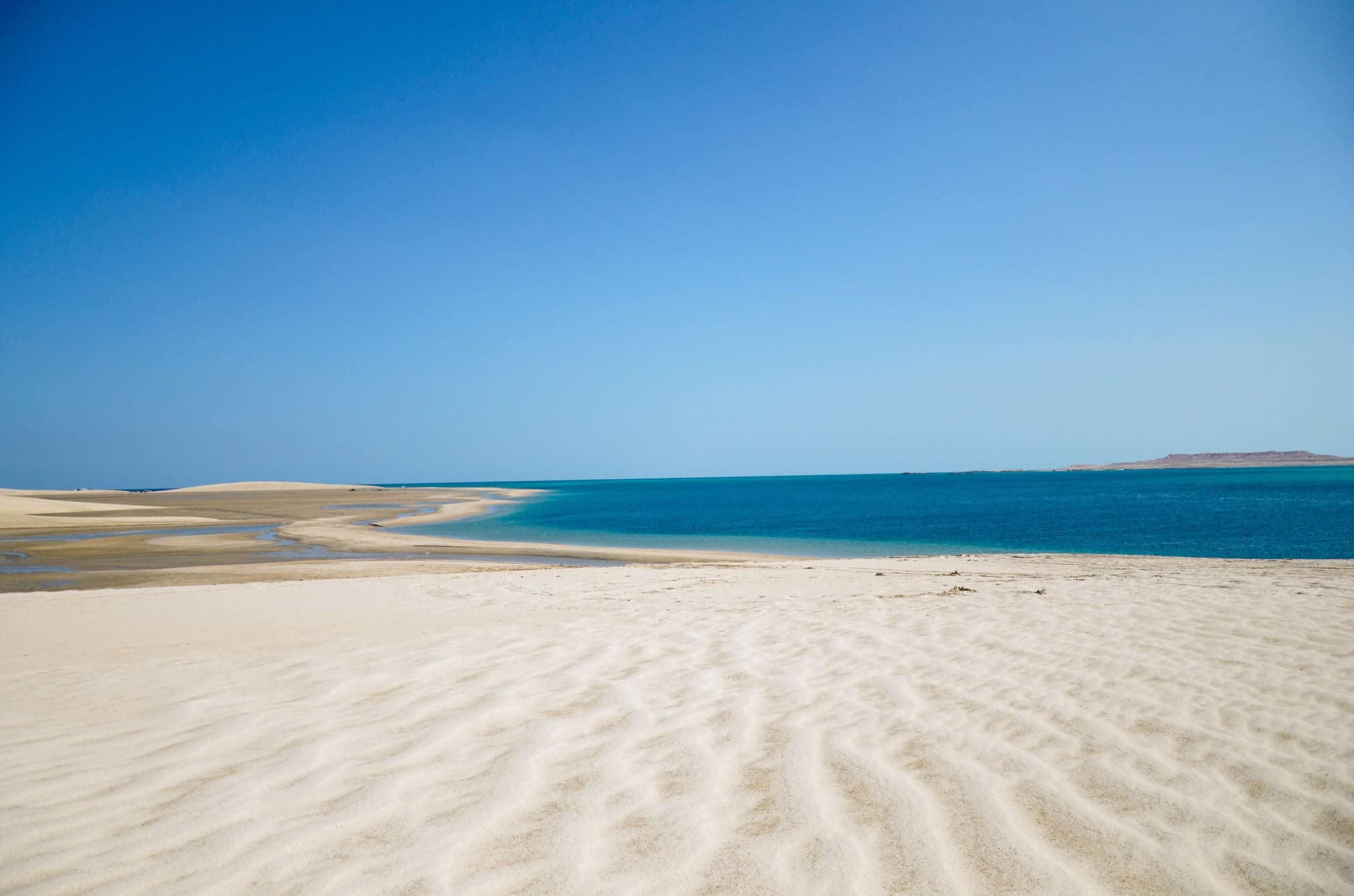 Scenic beauty of sand dunes descending into the sea, an ideal place for camping