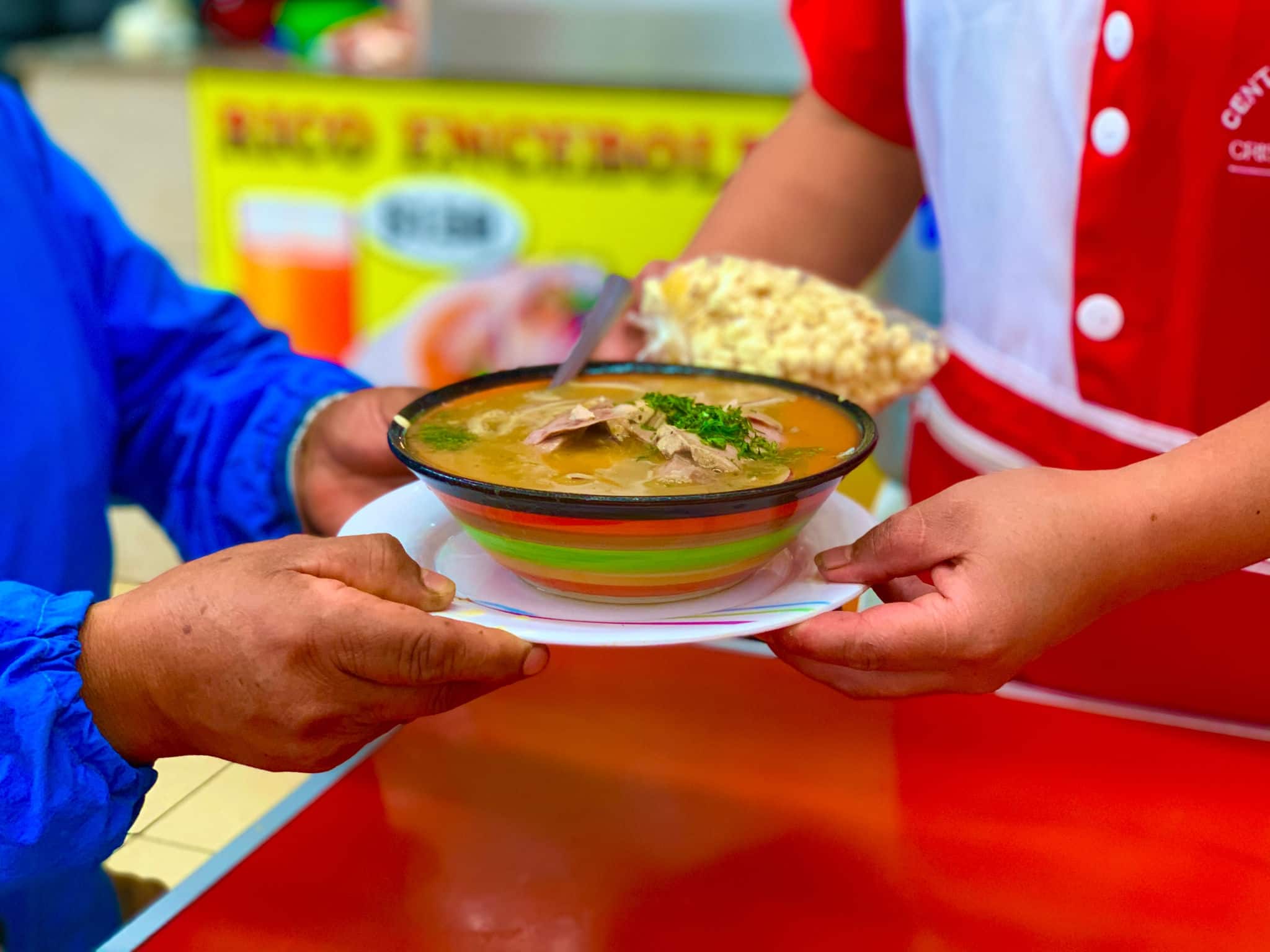 Encebollado, fish stew, served with banana chips and lemon. Delicious dish typical of Ecuador.