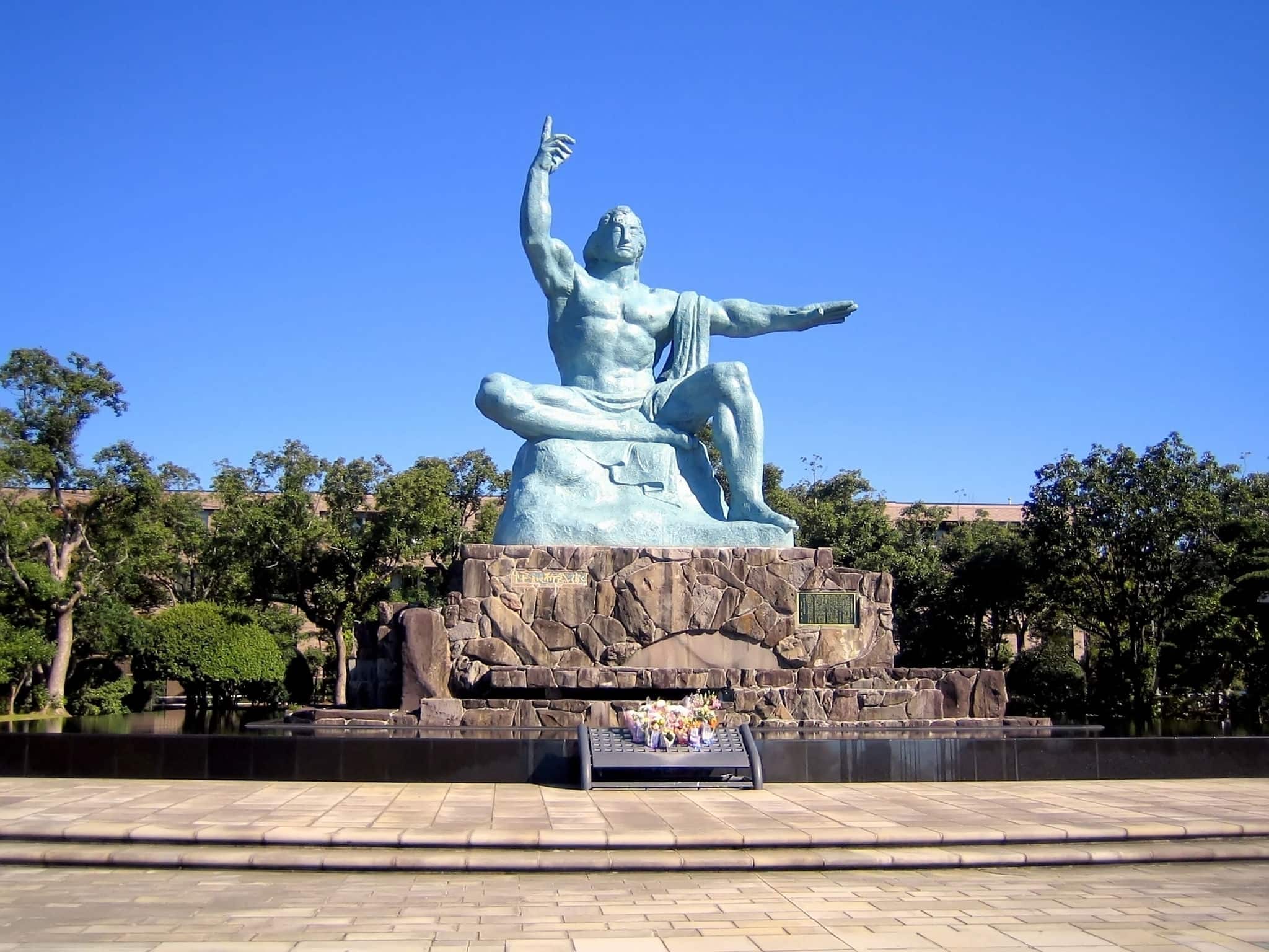The Peace Statue in Nagasaki Peace Park, Japan on a cloudless day. The park commemorates the atomic bombing of the city on August 9, 1945. It is next to the Atomic Bomb Museum.