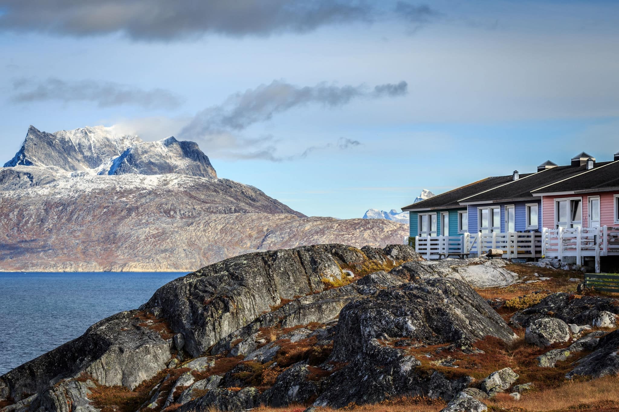 Colorful Inuit houses in Nuuk built on the rocks at the fjord