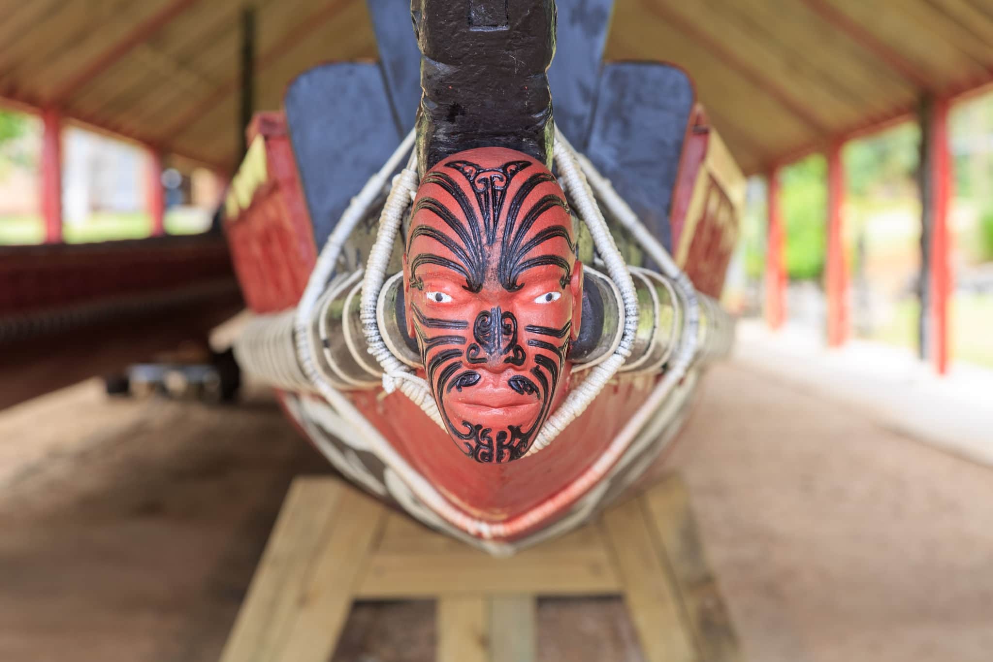 A typical maori puppet head with moko at the end of a war canoe in Waitangi, New Zealand