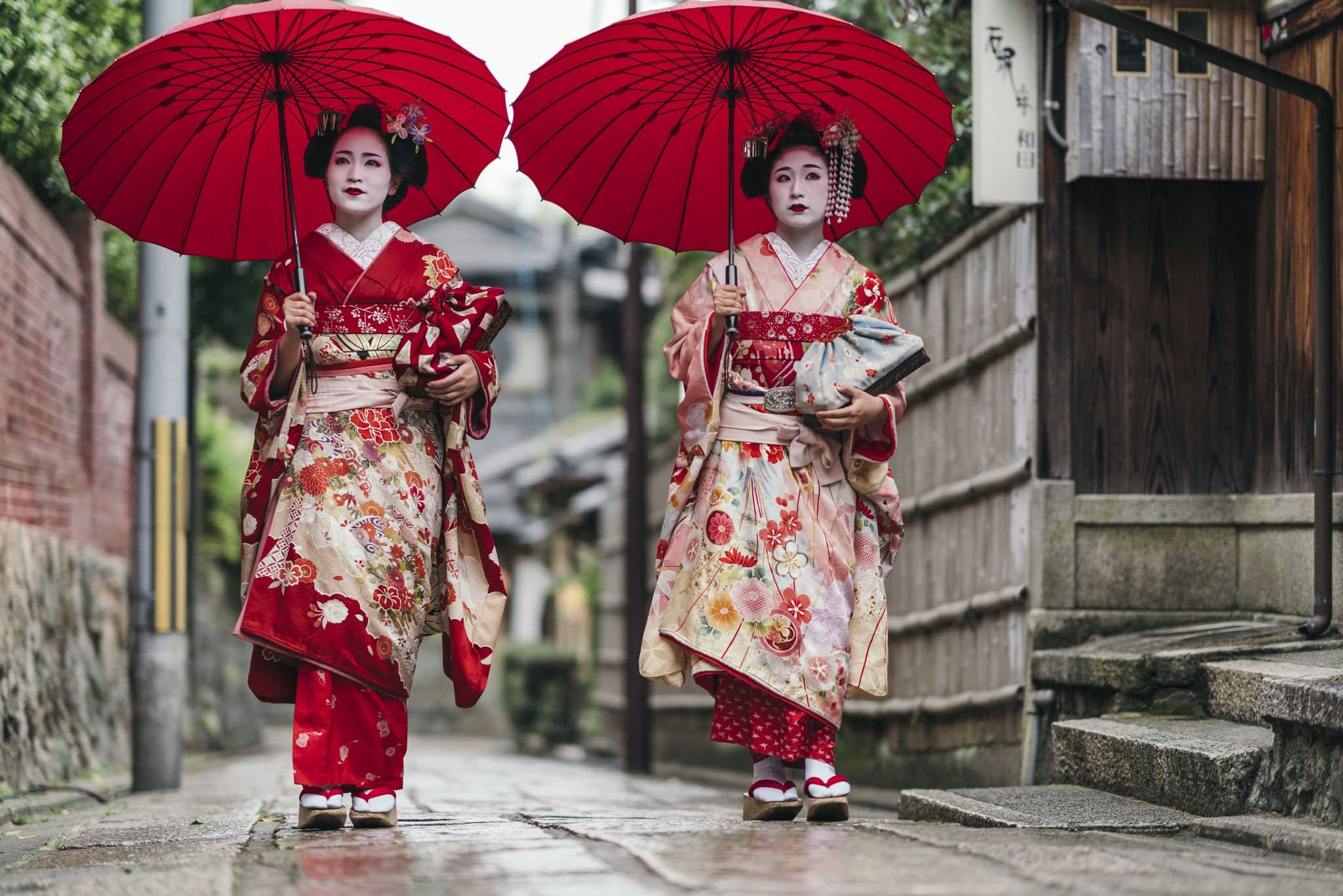 Maiko geisha walking on a street of Gion in Kyoto Japan