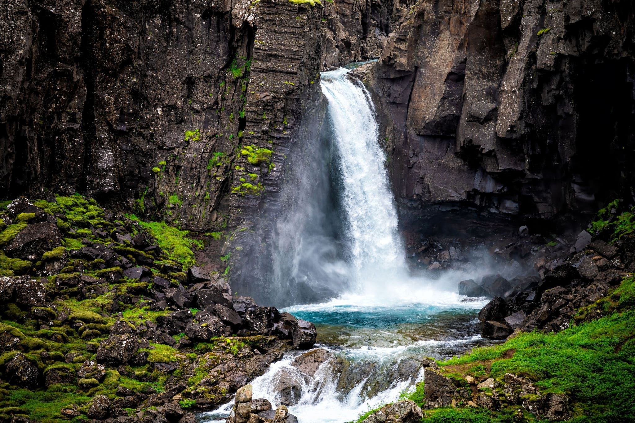Folaldafoss waterfall closeup of rocks and water fall in east Iceland cliff wall in Berufjordur area