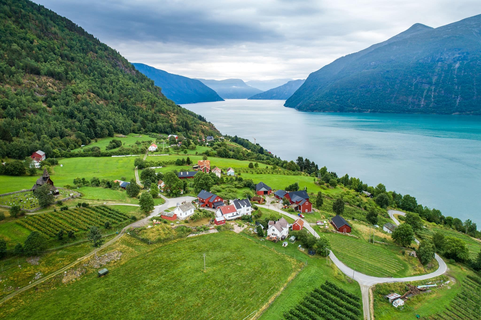 Aerial summer view of traditional Urnes rural village with farms in Lustrafjorden in Norway