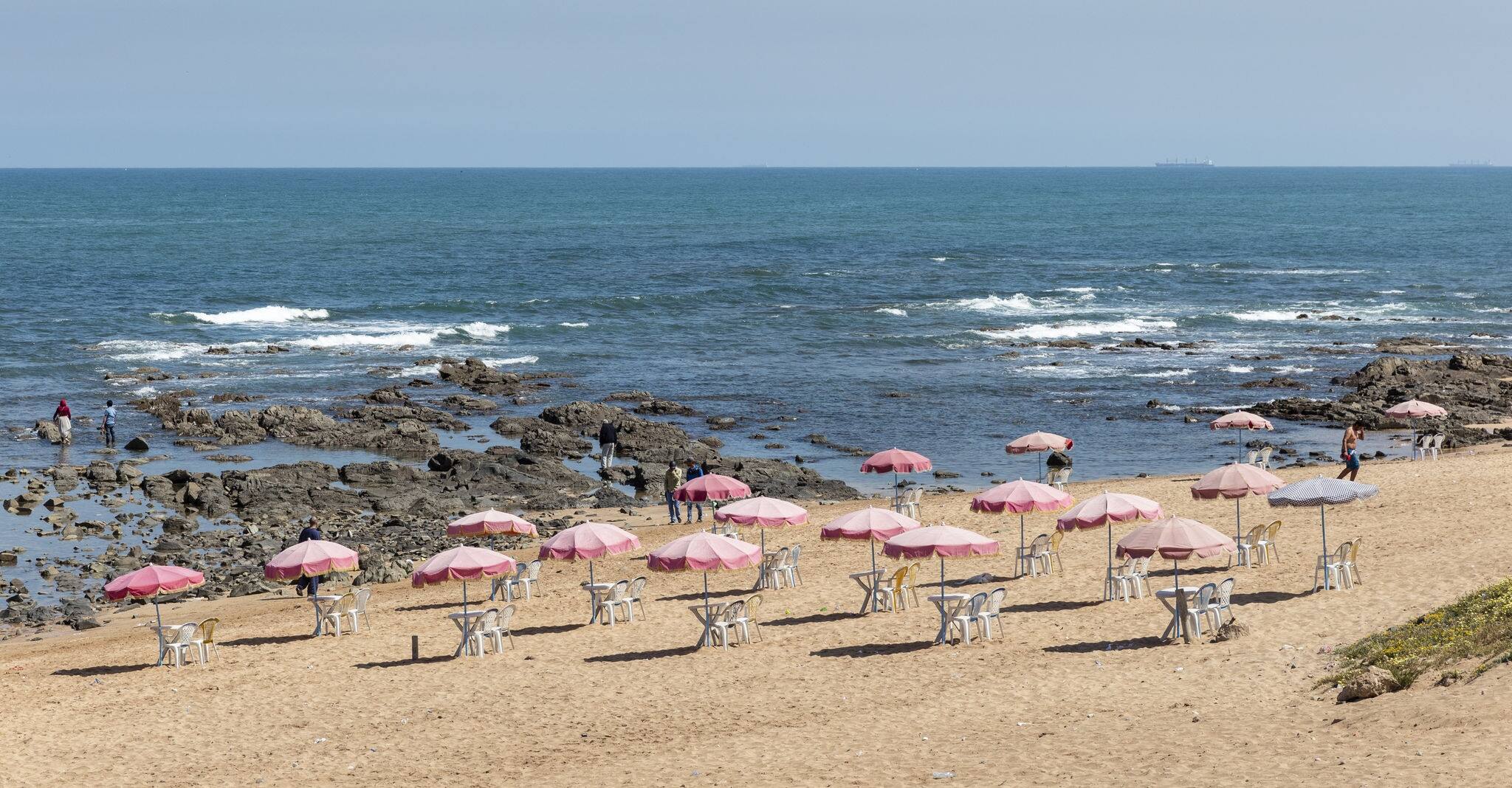CASABLANCA, MOROCCO - APRIL 18, 2016: Sun umbrellas on the beach of Casablanca